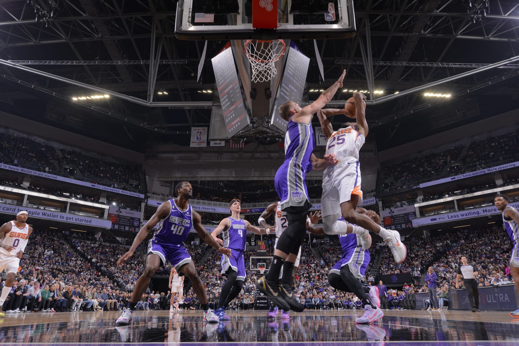 SACRAMENTO, CA - NOVEMBER 28: Mikal Bridges #25 of the Phoenix Suns drives to the basket against Domantas Sabonis #10 of the Sacramento Kings on November 28, 2022 at Golden 1 Center in Sacramento, California. NOTE TO USER: User expressly acknowledges and agrees that, by downloading and or using this photograph, User is consenting to the terms and conditions of the Getty Images Agreement. Mandatory Copyright Notice: Copyright 2022 NBAE (Photo by Rocky Widner/NBAE via Getty Images)