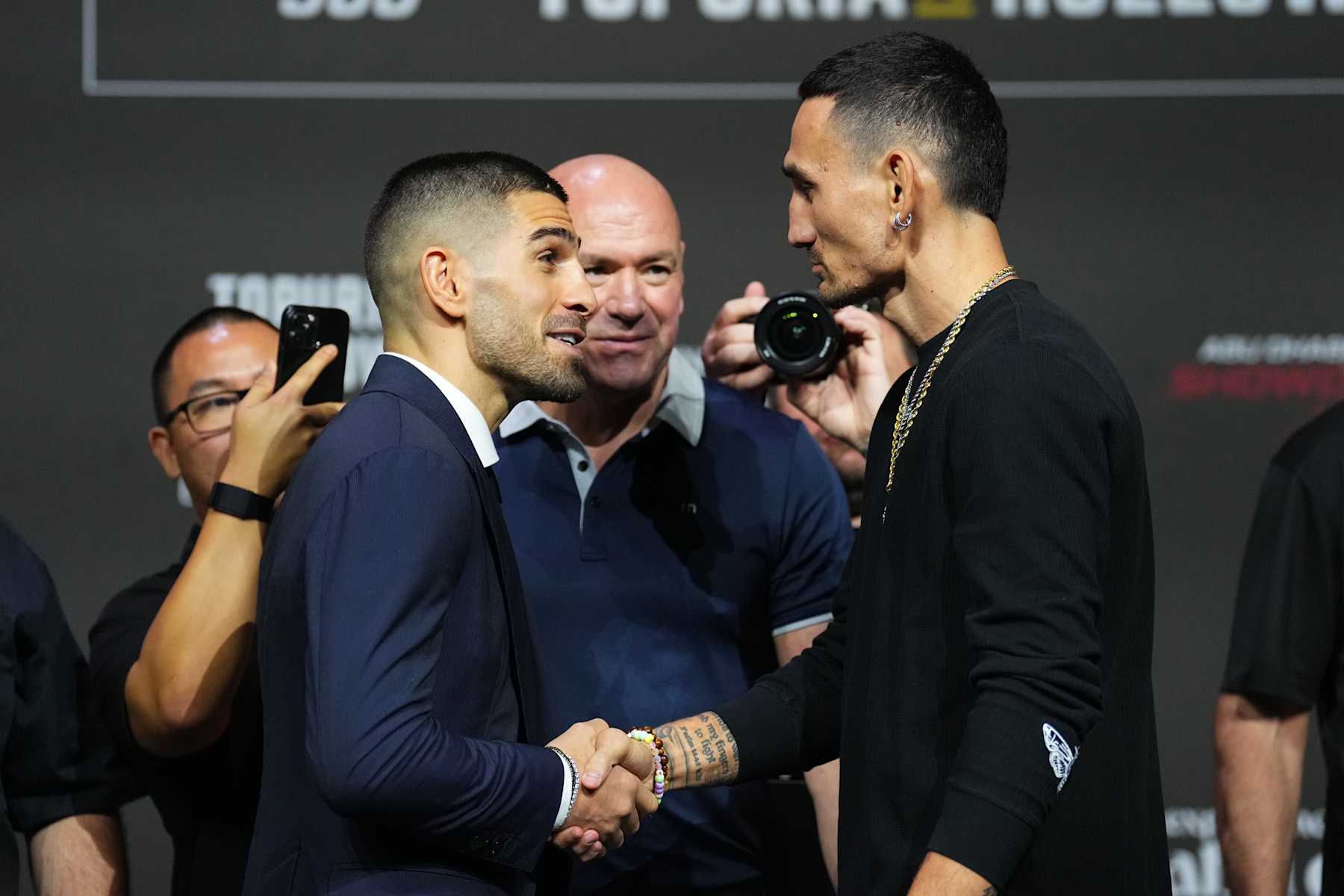 ABU DHABI, UNITED ARAB EMIRATES - OCTOBER 24: (L-R) Opponents Ilia Topuria of Spain and Max Holloway face off during the UFC 308 press conference at Etihad Arena on October 24, 2024 in Abu Dhabi, United Arab Emirates.  (Photo by Chris Unger/Zuffa LLC)