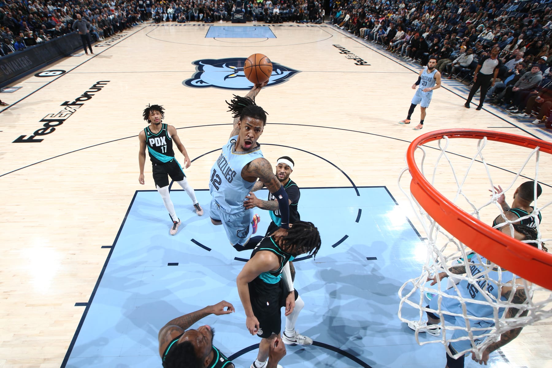 MEMPHIS, TN - FEBRUARY 1: Ja Morant #12 of the Memphis Grizzlies dunks the ball during the game against the Portland Trail Blazers on February 1, 2023 at FedExForum in Memphis, Tennessee. NOTE TO USER: User expressly acknowledges and agrees that, by downloading and or using this photograph, User is consenting to the terms and conditions of the Getty Images License Agreement. Mandatory Copyright Notice: Copyright 2022 NBAE (Photo by Joe Murphy/NBAE via Getty Images)