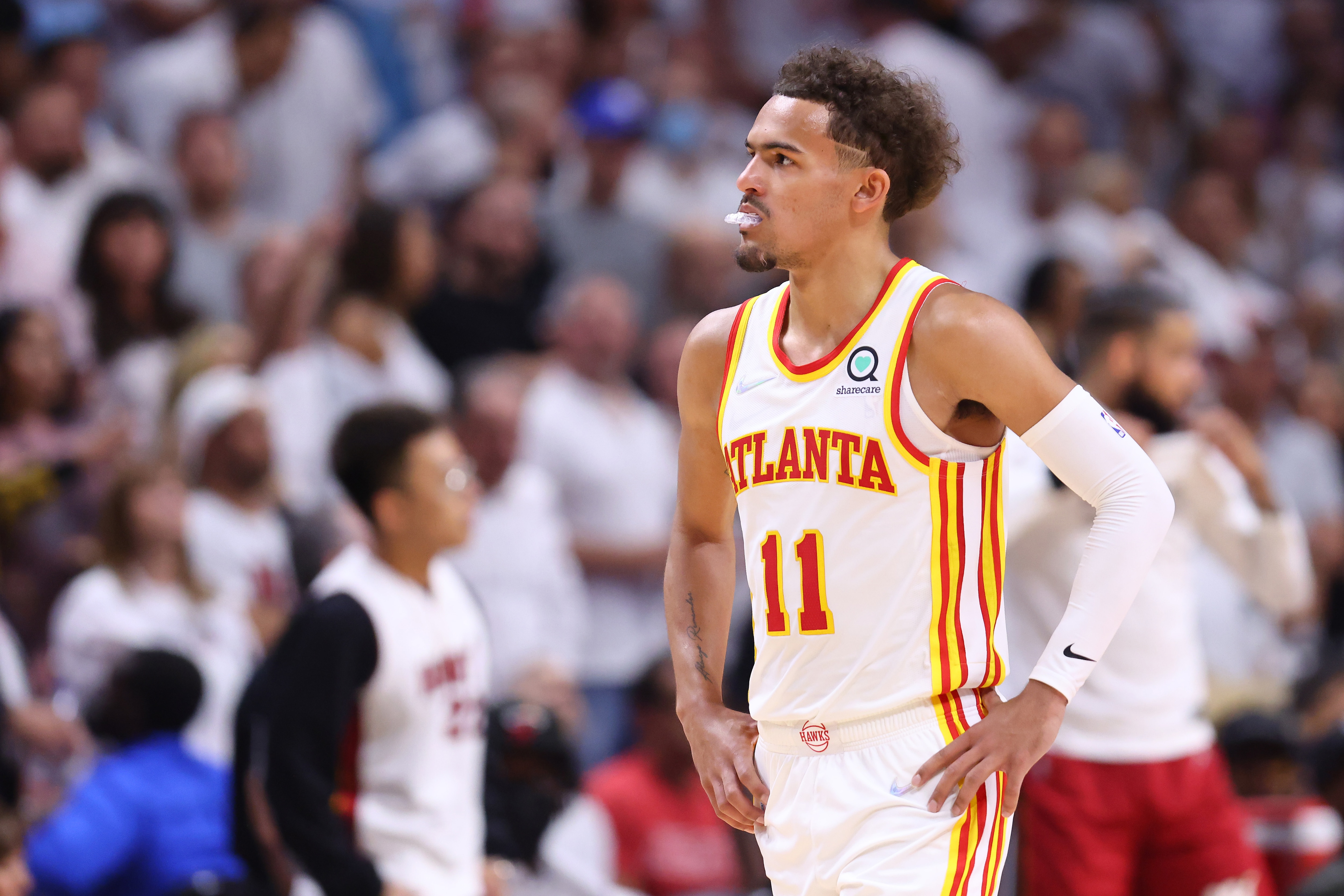 MIAMI, FLORIDA - APRIL 26: Trae Young #11 of the Atlanta Hawks reacts against the Miami Heat in Game Five of the Eastern Conference First Round at FTX Arena on April 26, 2022 in Miami, Florida. NOTE TO USER: User expressly acknowledges and agrees that, by downloading and or using this photograph, User is consenting to the terms and conditions of the Getty Images License Agreement.  (Photo by Michael Reaves/Getty Images)