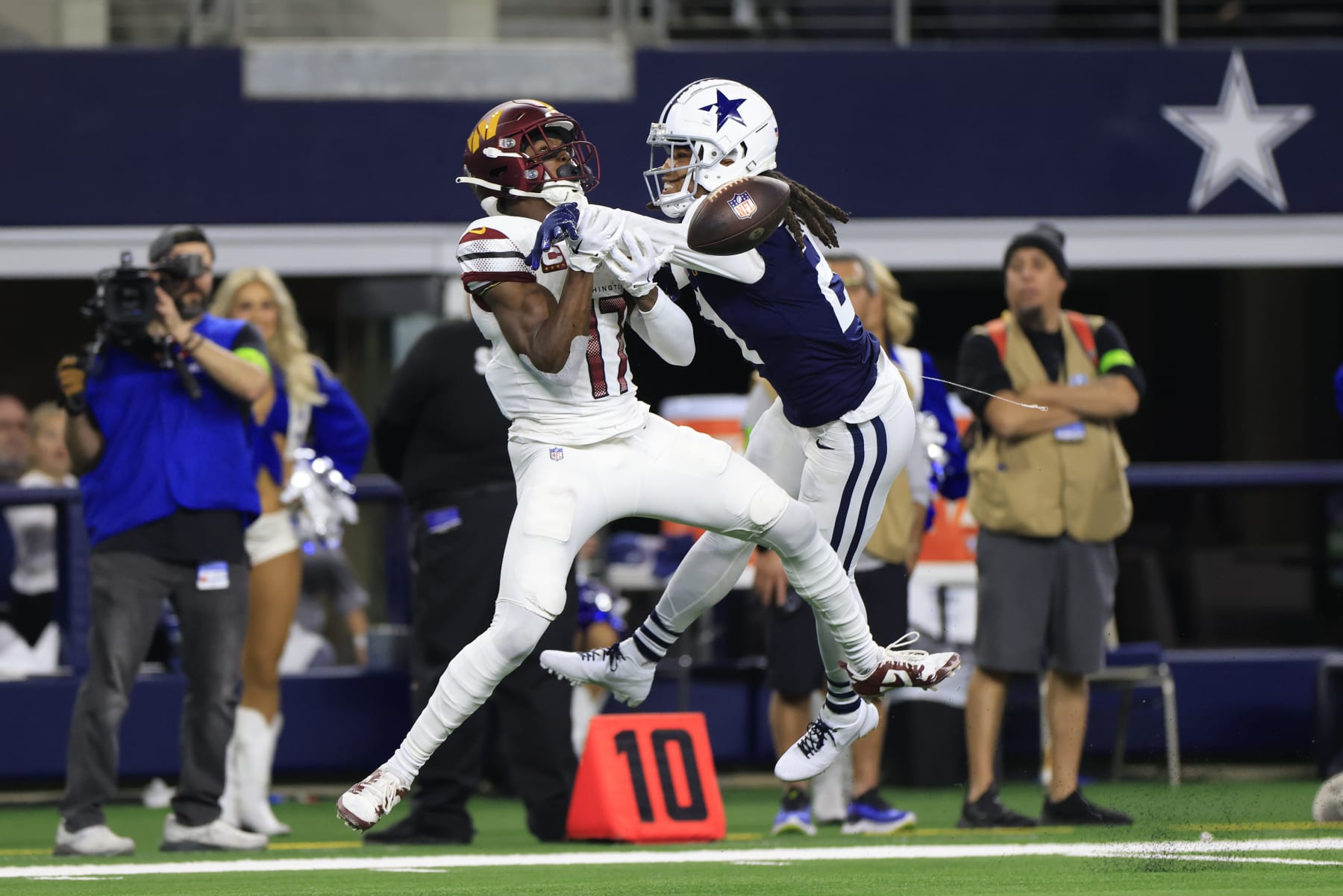 ARLINGTON, TEXAS - NOVEMBER 23: Stephon Gilmore #21 of the Dallas Cowboys breaks up a pass intended for Terry McLaurin #17 of the Washington Commanders during the third quarter at AT&T Stadium on November 23, 2023 in Arlington, Texas. (Photo by Ron Jenkins/Getty Images)