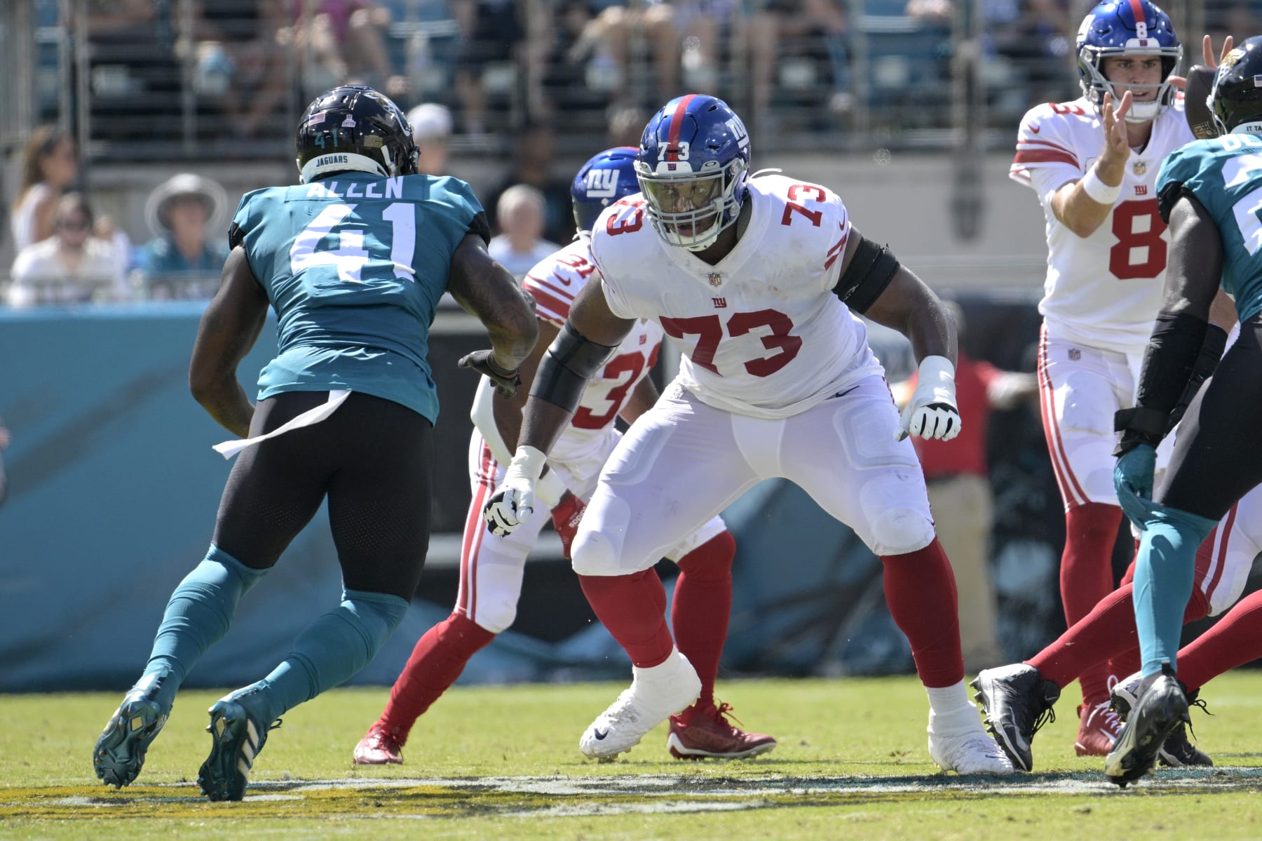 New York Giants offensive tackle Evan Neal (73) sets up to block in front of Jacksonville Jaguars linebacker Josh Allen (41) during the first half of an NFL football game, Sunday, Oct. 23, 2022, in Jacksonville, Fla. (AP Photo/Phelan M. Ebenhack)
