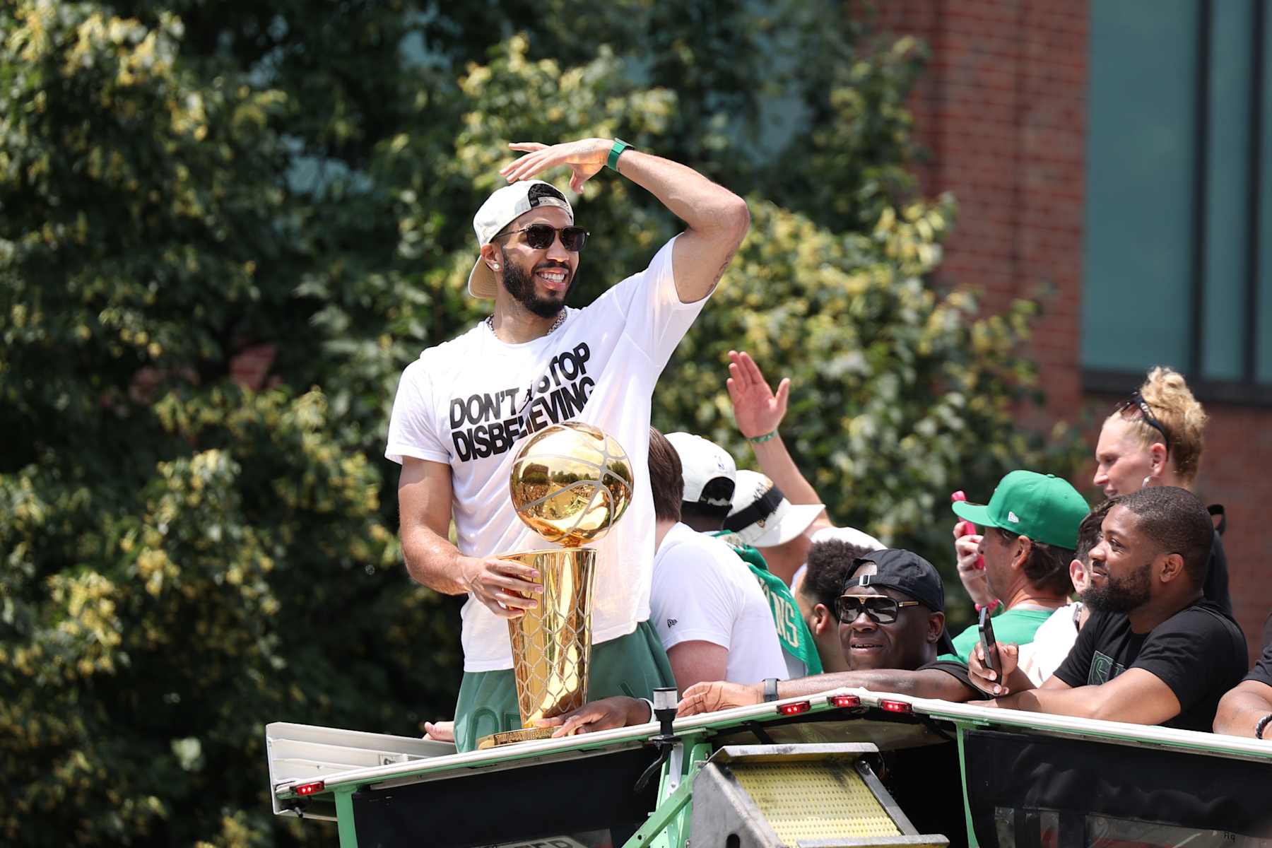BOSTON, MA - JUNE 21: Jayson Tatum #0 of the Boston Celtics celebrates with the Larry O'Brien Trophy during the 2024 Boston Celtics championship parade on June 21, 2024 in Boston, Massachusetts. NOTE TO USER: User expressly acknowledges and agrees that, by downloading and or using this photograph, User is consenting to the terms and conditions of the Getty Images License Agreement. Mandatory Copyright Notice: Copyright 2024 NBAE  (Photo by Grace Beal/NBAE via Getty Images)