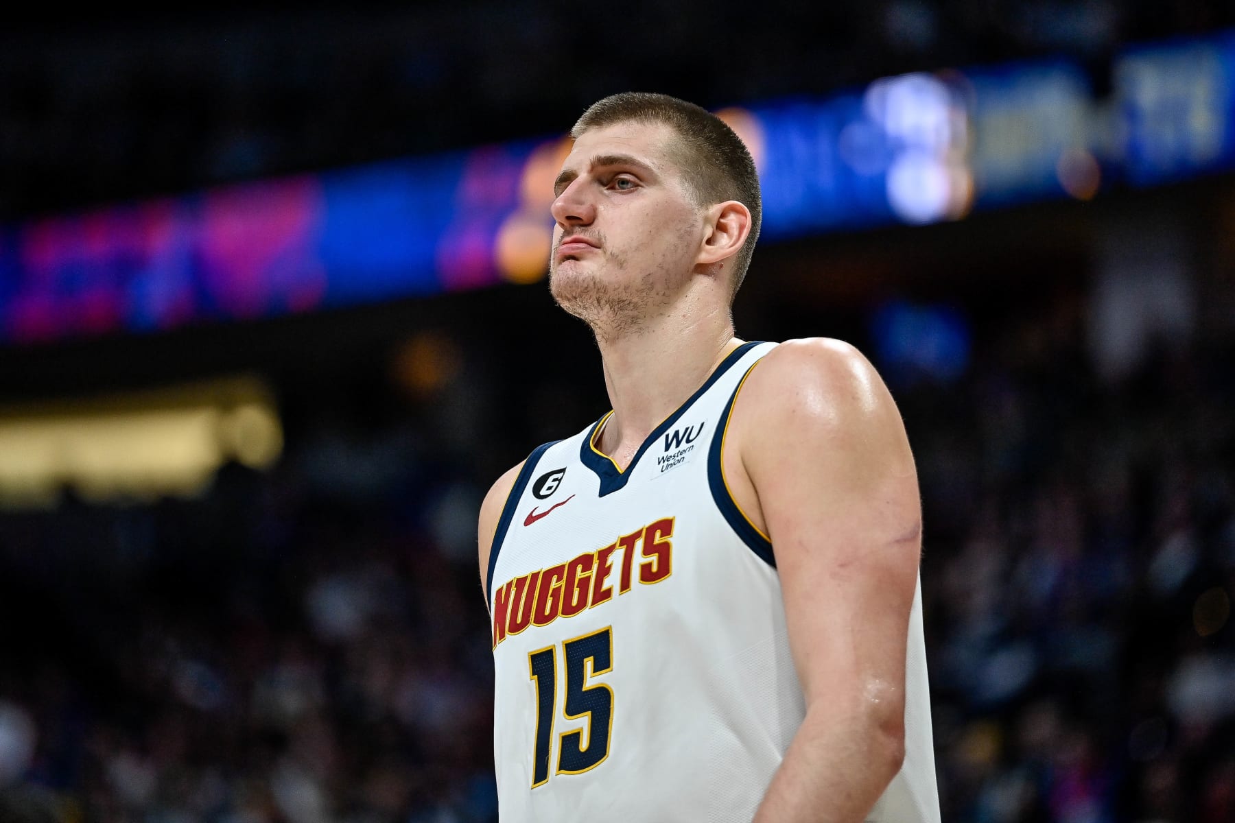 DENVER, CO - MARCH 27:  Nikola Jokic #15 of the Denver Nuggets looks on in a game against the Philadelphia 76ers at Ball Arena on March 27, 2023 in Denver, Colorado. NOTE TO USER: User expressly acknowledges and agrees that, by downloading and or using this photograph, User is consenting to the terms and conditions of the Getty Images License Agreement. (Photo by Dustin Bradford/Getty Images)