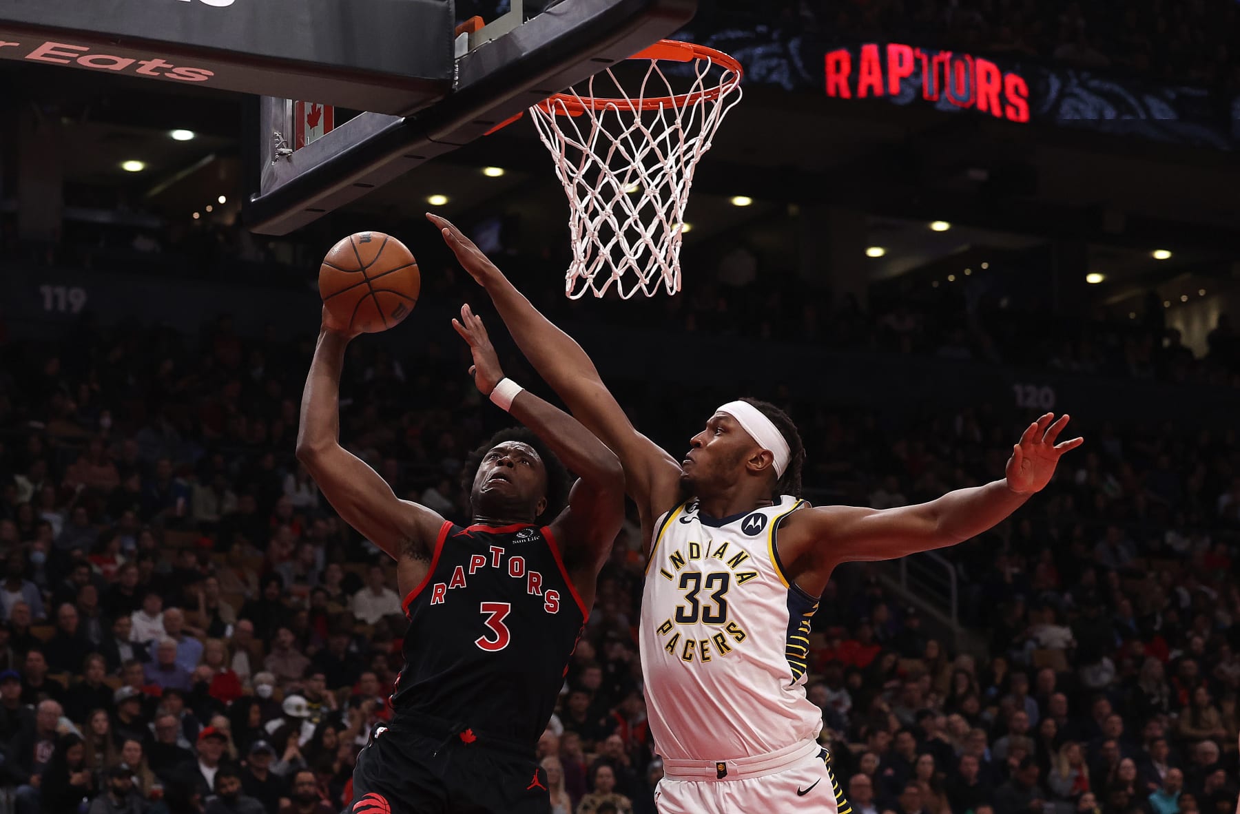 TORONTO, ON- MARCH 22  - Toronto Raptors forward O.G. Anunoby (3) is defended by Indiana Pacers center Myles Turner (33) as the Toronto Raptors play the Indiana Pacers at Scotiabank Arena in Toronto. March 22, 2023.        (Steve Russell/Toronto Star via Getty Images)