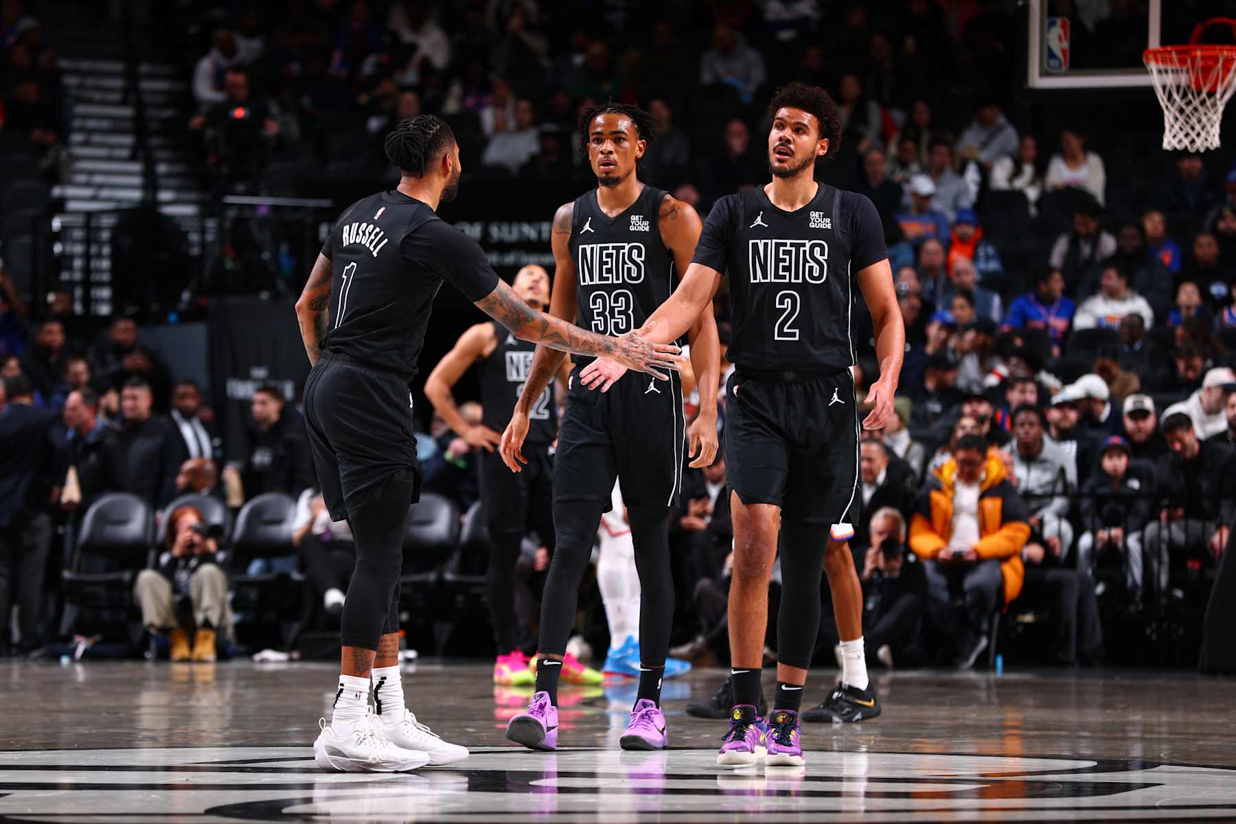 BROOKLYN, NY - JANUARY 21: Cameron Johnson #2 and D'Angelo Russell #1 of the Brooklyn Nets high five during the game against the New York Knicks on January 21, 2025 at Barclays Center in Brooklyn, New York. NOTE TO USER: User expressly acknowledges and agrees that, by downloading and or using this Photograph, user is consenting to the terms and conditions of the Getty Images License Agreement. Mandatory Copyright Notice: Copyright 2025 NBAE (Photo by David L. Nemec/NBAE via Getty Images)