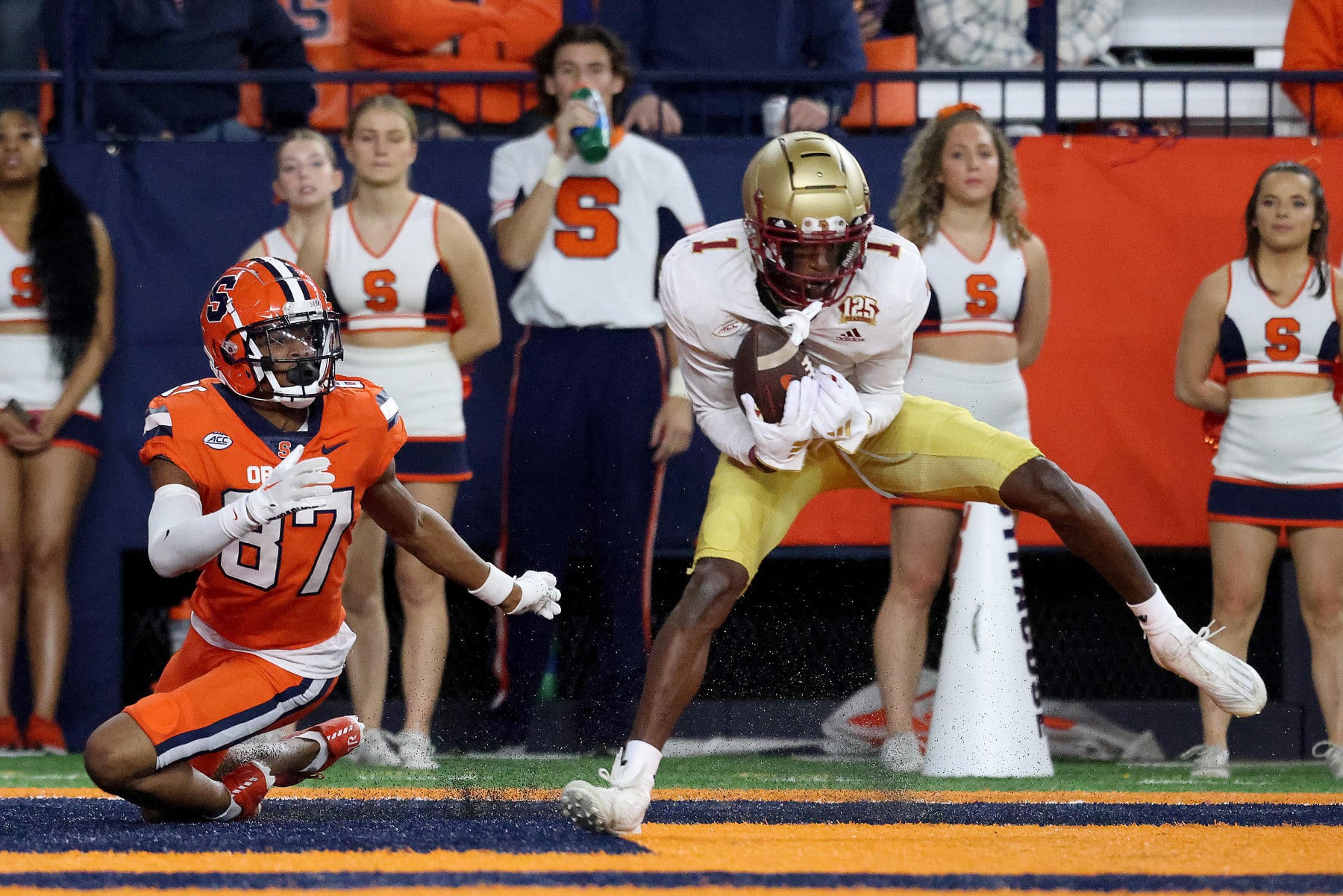 SYRACUSE, NEW YORK - NOVEMBER 03: Donovan Brown #87 of the Syracuse Orange falls as Elijah Jones #1 of the Boston College Eagles intercepts a pass during the second quarter at JMA Wireless Dome on November 03, 2023 in Syracuse, New York. (Photo by Bryan Bennett/Getty Images)
