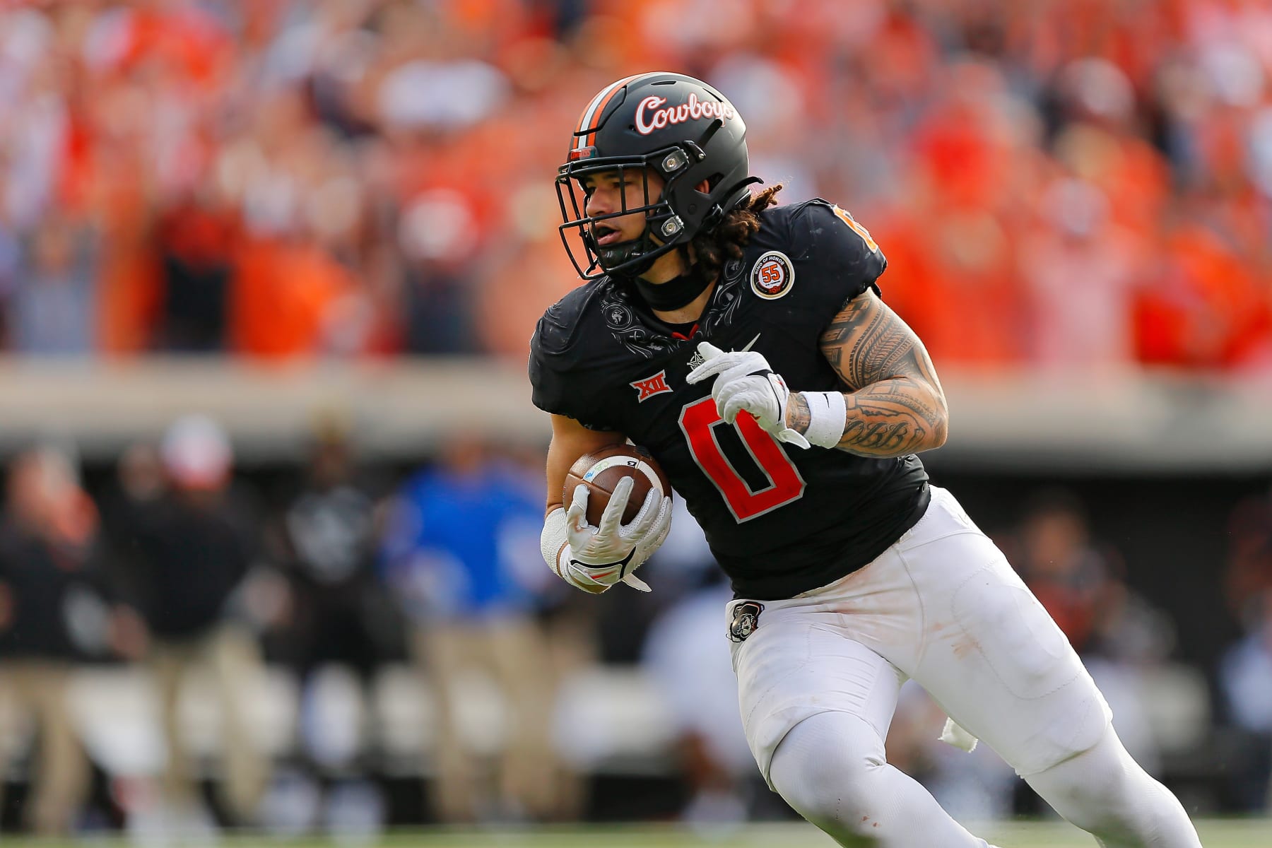 STILLWATER, OK - OCTOBER 8:  Linebacker Mason Cobb #0 of the Oklahoma State Cowboys intercepts a 10-yard pass for a 19-yard return setting up the go-ahead field goal against the Texas Tech Red Raiders in the third quarter at Boone Pickens Stadium on October 8, 2022 in Stillwater, Oklahoma.  Oklahoma State won 41-31.  (Photo by Brian Bahr/Getty Images)