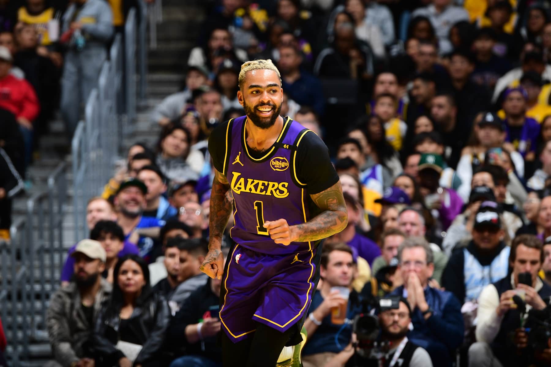 LOS ANGELES, CA - NOVEMBER 19: D'Angelo Russell #1 of the Los Angeles Lakers smiles during the game against the Utah Jazz during the Emirates NBA Cup game on November 19, 2024 at Crypto.Com Arena in Los Angeles, California. NOTE TO USER: User expressly acknowledges and agrees that, by downloading and/or using this Photograph, user is consenting to the terms and conditions of the Getty Images License Agreement. Mandatory Copyright Notice: Copyright 2024 NBAE (Photo by Adam Pantozzi/NBAE via Getty Images)