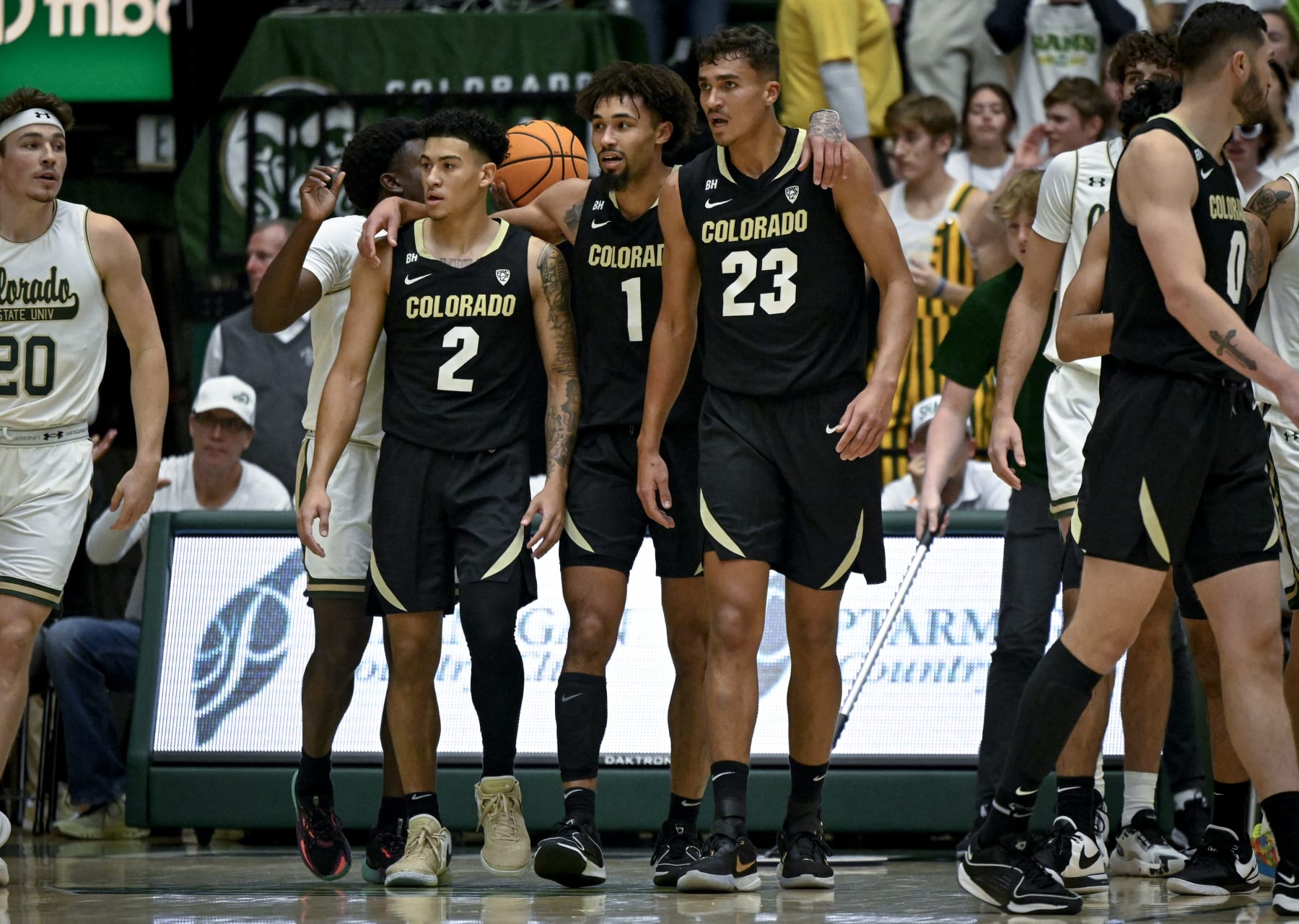 FORT COLLINS, CO - NOVEMBER 29: KJ Simpson (2) J'Vonne Hadley (1) and Tristan da Silva (23) of the Colorado Buffaloes regroup after Nique Clifford (10) of the Colorado State Rams drew a foul during the first half at Moby Arena in Fort Collins on Wednesday, November 29, 2023. (Photo by AAron Ontiveroz/The Denver Post)