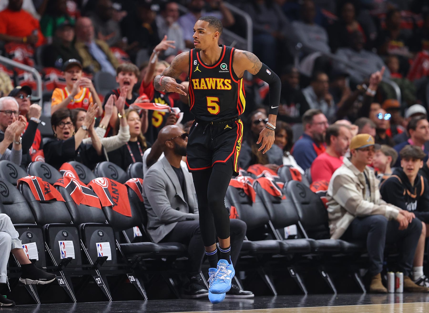 ATLANTA, GEORGIA - APRIL 23:  Dejounte Murray #5 of the Atlanta Hawks reacts after hitting a three-point basket against the Boston Celtics during the first quarter of Game Four of the Eastern Conference First Round Playoffs at State Farm Arena on April 23, 2023 in Atlanta, Georgia. NOTE TO USER: User expressly acknowledges and agrees that, by downloading and or using this photograph, User is consenting to the terms and conditions of the Getty Images License Agreement.  (Photo by Kevin C. Cox/Getty Images)