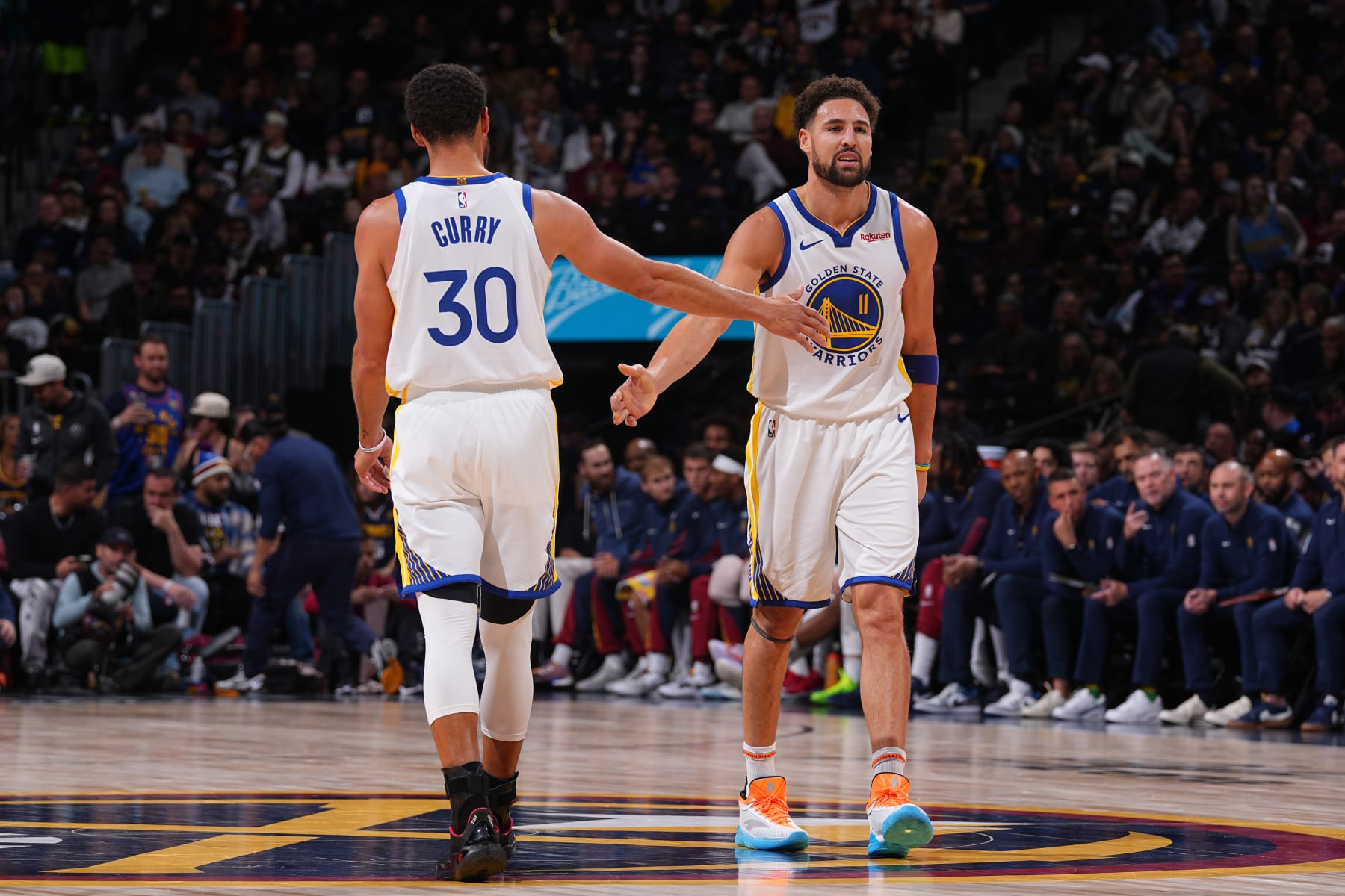 DENVER, CO - NOVEMBER 8: Stephen Curry #30 and Klay Thompson #11 of the Golden State Warriors high fives  during the game against the Denver Nuggets on November 8, 2023 at the Ball Arena in Denver, Colorado. NOTE TO USER: User expressly acknowledges and agrees that, by downloading and/or using this Photograph, user is consenting to the terms and conditions of the Getty Images License Agreement. Mandatory Copyright Notice: Copyright 2023 NBAE (Photo by Bart Young/NBAE via Getty Images)