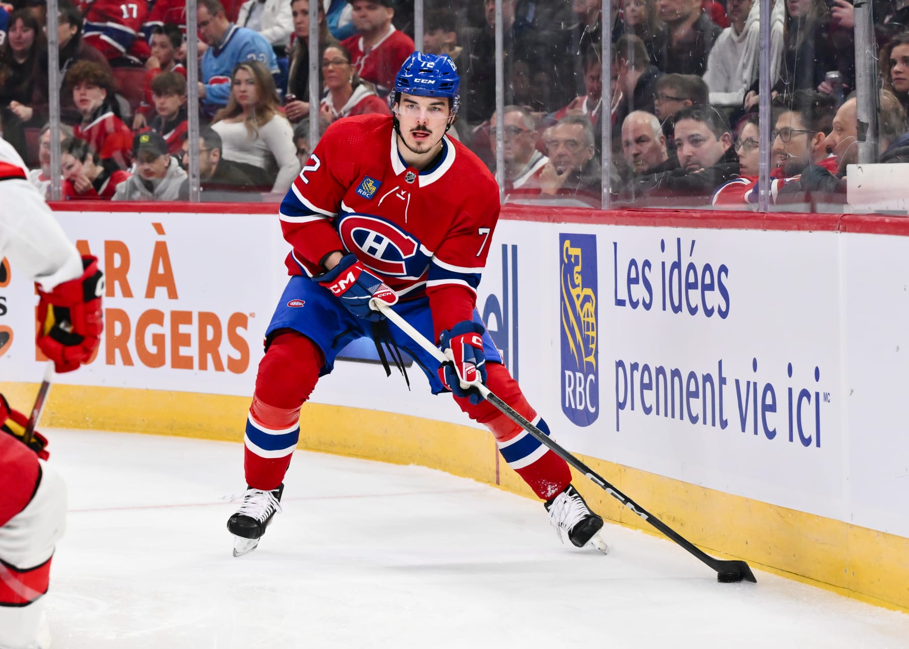 MONTREAL, CANADA - MARCH 30:  Arber Xhekaj #72 of the Montreal Canadiens skates the puck during the first period against the Carolina Hurricanes at the Bell Centre on March 30, 2024 in Montreal, Quebec, Canada.  The Carolina Hurricanes defeated the Montreal Canadiens 3-0.  (Photo by Minas Panagiotakis/Getty Images)