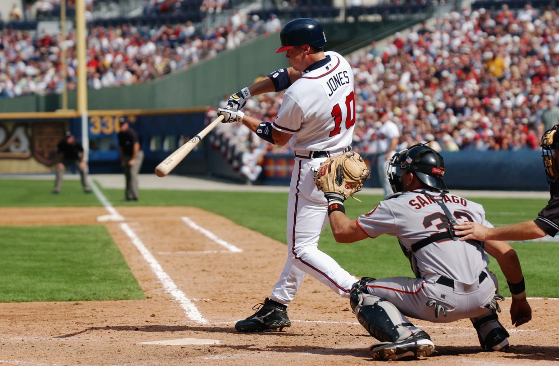 ATLANTA - OCTOBER 2:  Left fielder Chipper Jones #10 of the Atlanta Braves swings at the pitch during game one of the National League Division Series against the San Francisco Giants at Turner Field in Atlanta, Georgia on October 2, 2002.  The Giants defeated the Braves 8-5, giving them the first win in the five-game series.  (Photo by: Doug Pensinger /Getty Images)