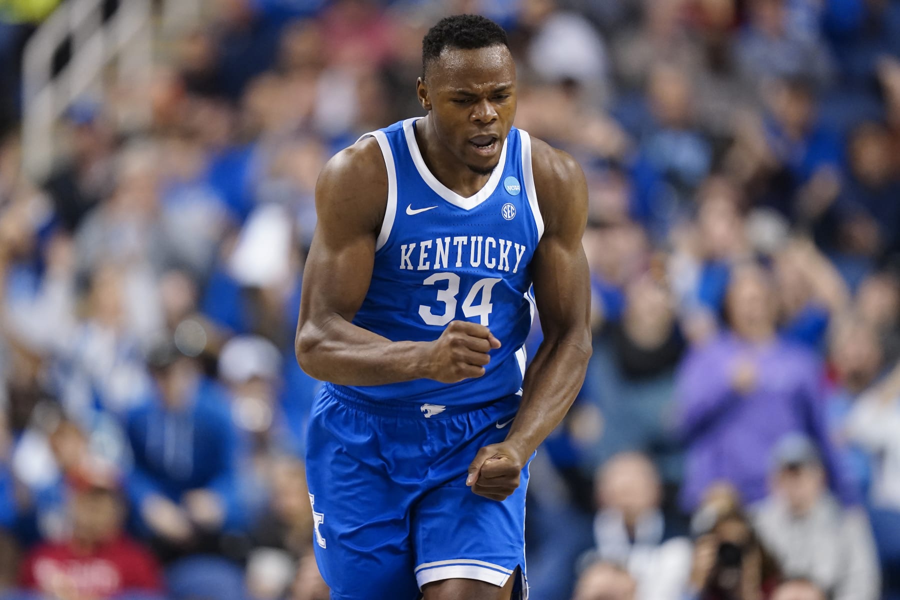GREENSBORO, NORTH CAROLINA - MARCH 19: Oscar Tshiebwe #34 of the Kentucky Wildcats reacts during the first half against the Kansas State Wildcats in the second round of the NCAA Men's Basketball Tournament at The Fieldhouse at Greensboro Coliseum on March 19, 2023 in Greensboro, North Carolina. (Photo by Jacob Kupferman/Getty Images)