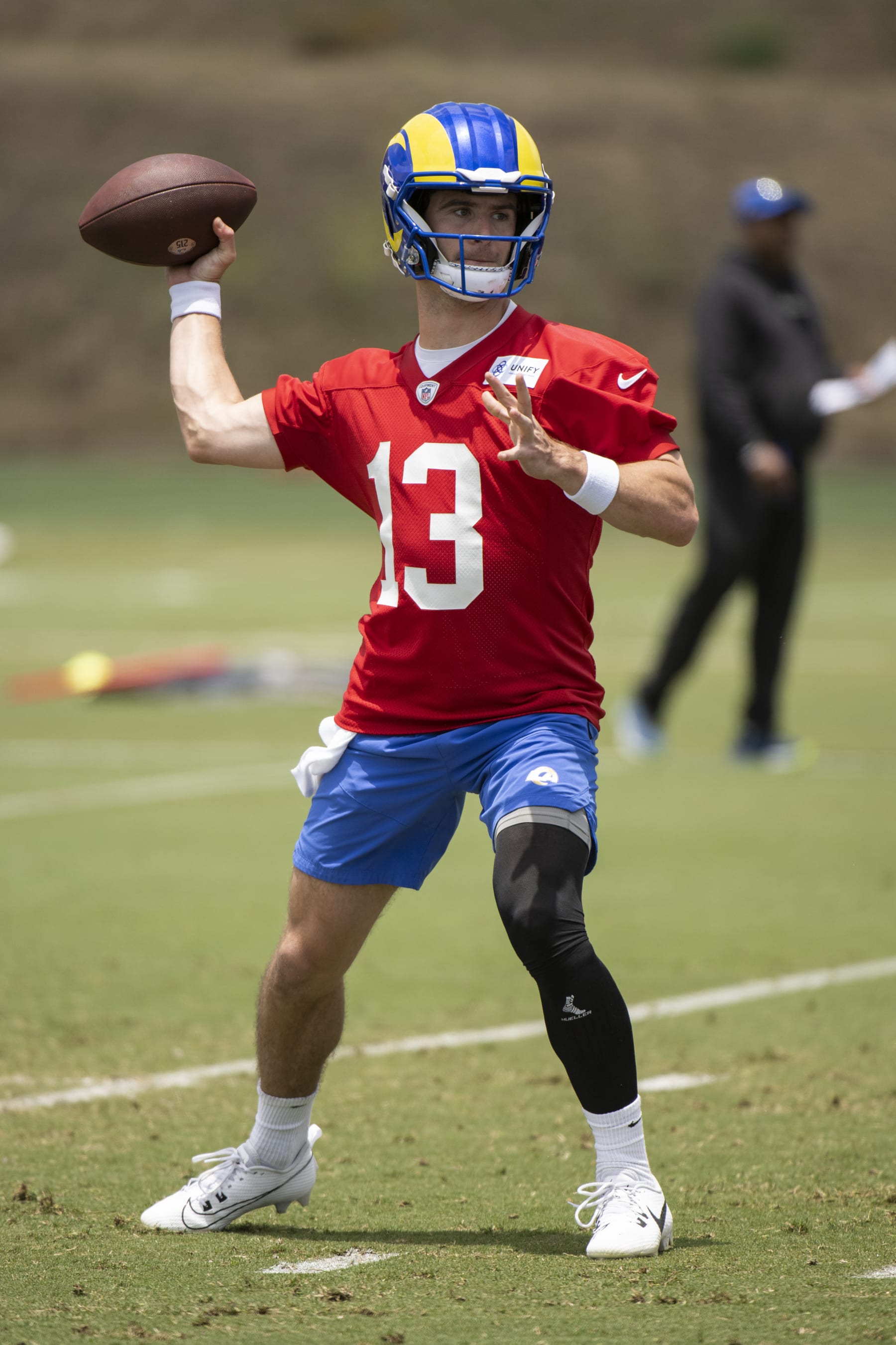Los Angeles Rams quarterback Stetson Bennett (13) throws a pass during the NFL football team's camp Tuesday, June 13, 2023, in Thousand Oaks, Calif. (AP Photo/Kyusung Gong)