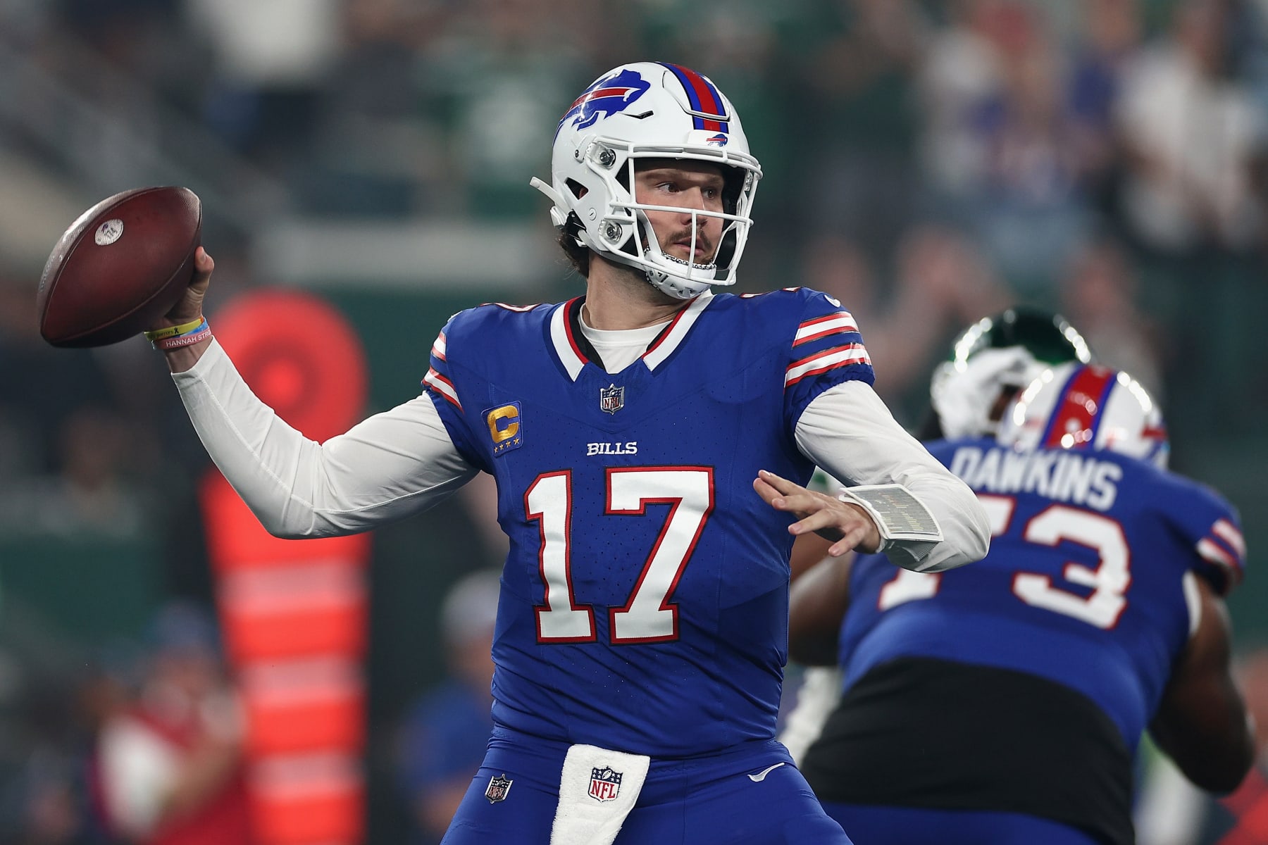 EAST RUTHERFORD, NEW JERSEY - SEPTEMBER 11: Quarterback Josh Allen #17 of the Buffalo Bills throws a pass during the first quarter of the NFL game against the New York Jets at MetLife Stadium on September 11, 2023 in East Rutherford, New Jersey. (Photo by Elsa/Getty Images)