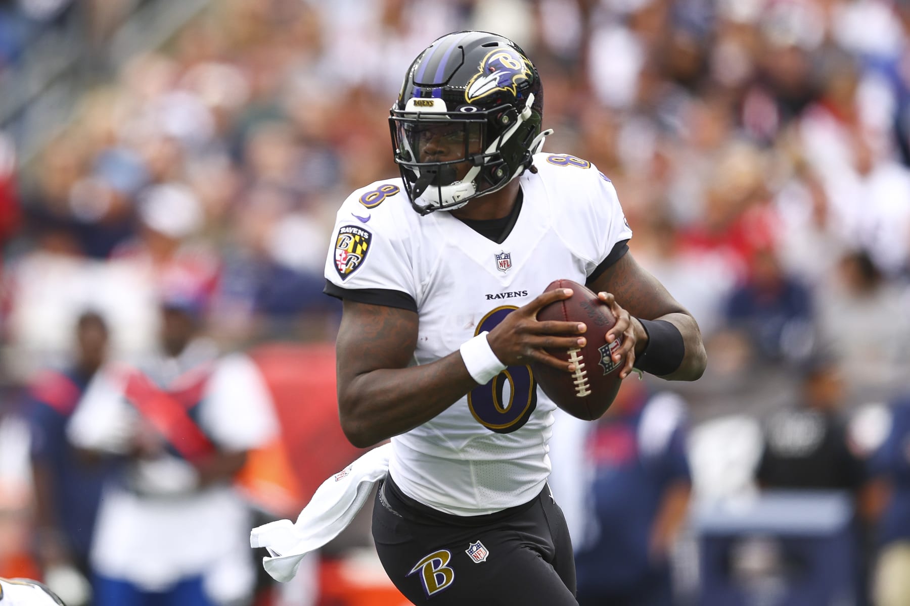 FOXBOROUGH, MASSACHUSETTS - SEPTEMBER 25: Quarterback Lamar Jackson #8 of the Baltimore Ravens attempts a pass during the first half at Gillette Stadium on September 25, 2022 in Foxborough, Massachusetts. (Photo by Adam Glanzman/Getty Images) FOXBOROUGH, MASSACHUSETTS - SEPTEMBER 25: Quarterback Lamar Jackson #8 of the Baltimore Ravens attempts a pass during the first half at Gillette Stadium on September 25, 2022 in Foxborough, Massachusetts. (Photo by Adam Glanzman/Getty Images)