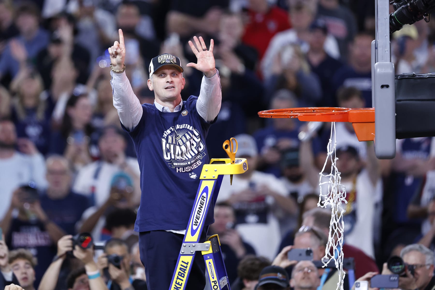 GLENDALE, ARIZONA - APRIL 08: Head coach Dan Hurley of the Connecticut Huskies cuts down the net after beating the Purdue Boilermakers 75-60 to win the NCAA Men's Basketball Tournament National Championship game at State Farm Stadium on April 08, 2024 in Glendale, Arizona. (Photo by Chris Coduto/Getty Images)