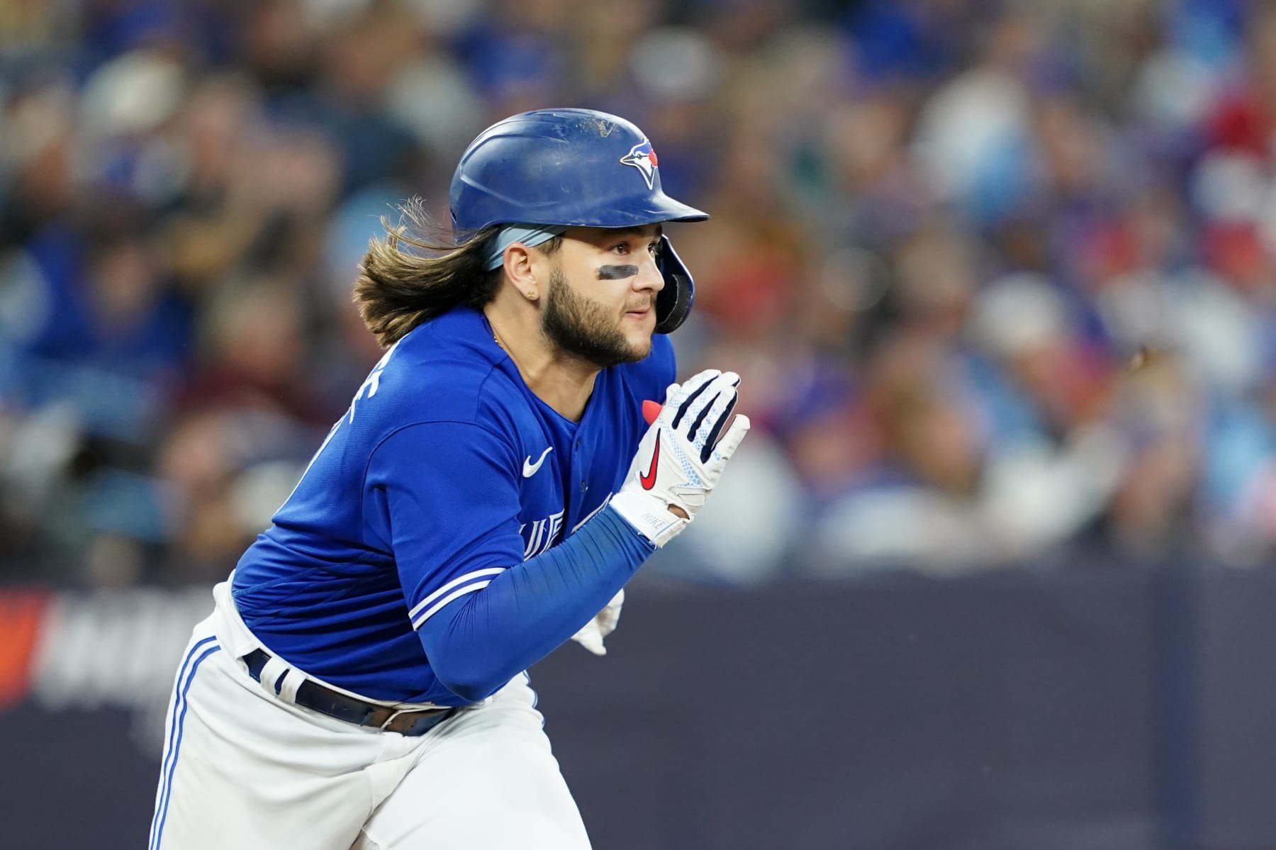 TORONTO,  - OCTOBER 08:   Bo Bichette #11 of the Toronto Blue Jays doubles in the fifth inning during the Wild Card Series game between the Seattle Mariners and the Toronto Blue Jays at Rogers Centre on Saturday, October 8, 2022 in Toronto, Canada. (Photo by Thomas Skrlj/MLB Photos via Getty Images)
