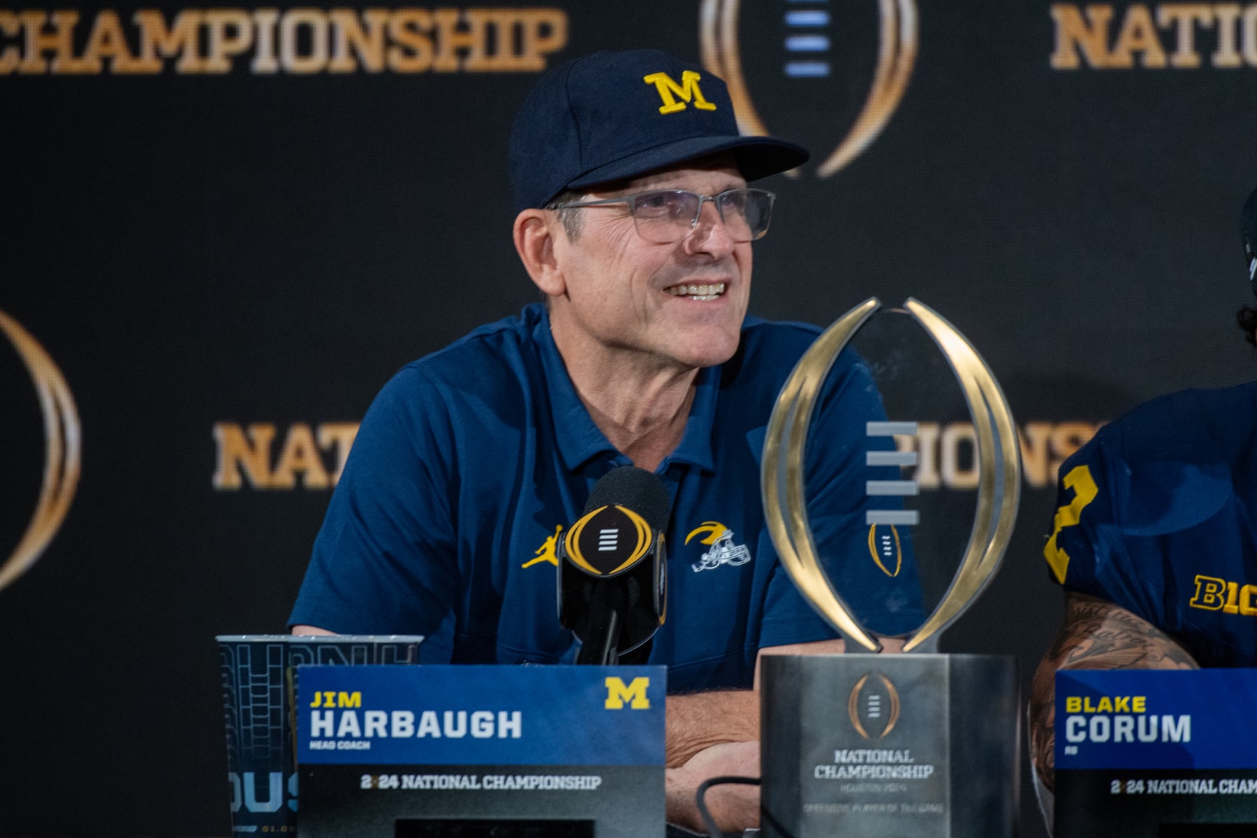 HOUSTON, TEXAS - JANUARY 08: Head Football Coach Jim Harbaugh of the Michigan Wolverines speaks to media during the post game press conference after winning the 2024 CFP National Championship game against the Washington Huskies at NRG Stadium on January 08, 2024 in Houston, Texas. The Michigan Wolverines won the game 34-17. (Photo by Aaron J. Thornton/Getty Images)