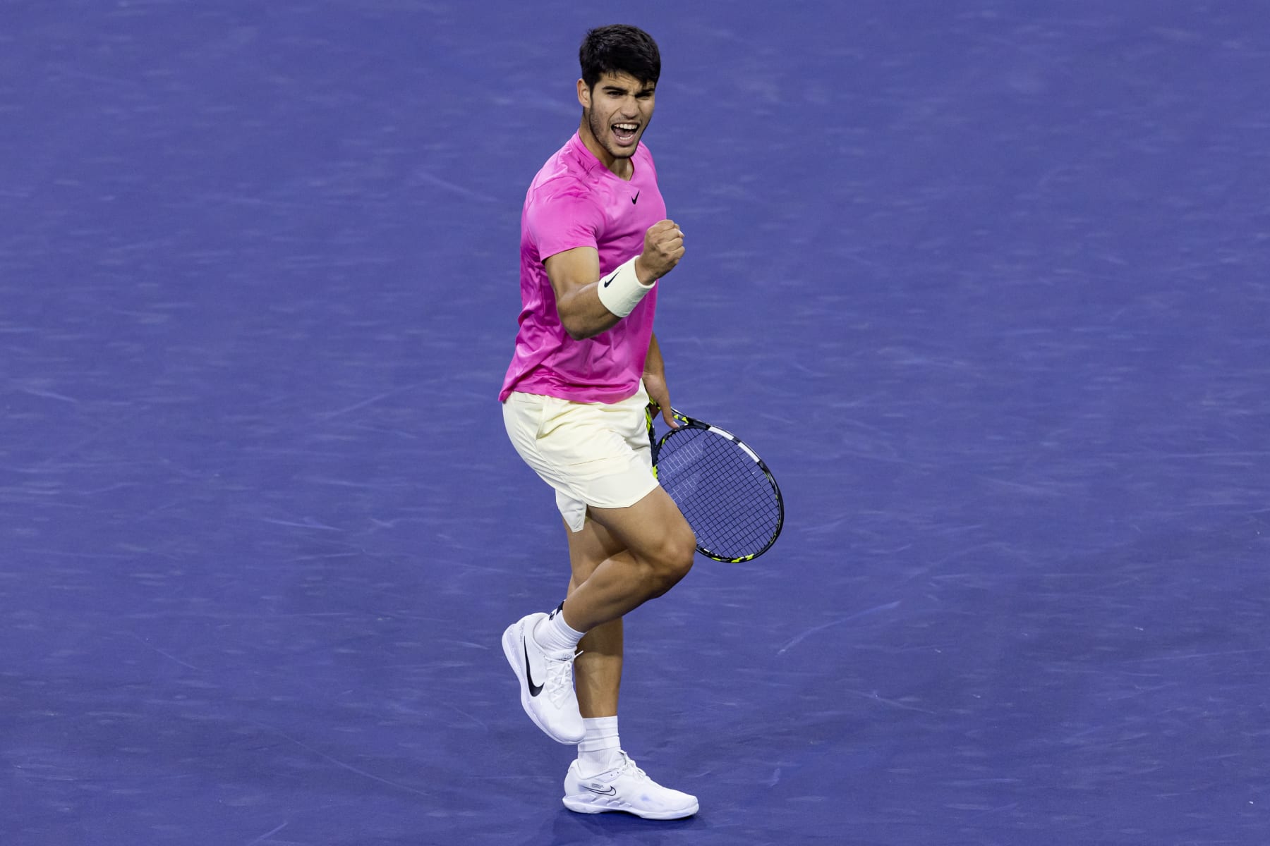 INDIAN WELLS, CALIFORNIA - MARCH 16: Carlos Alcaraz of Spain celebrates celebrates against Felix Auger-Aliassime in the quarter-final of the BNP Paribas Open on March 16, 2023 in Indian Wells, California. (Photo by Mike Frey/Getty Images)