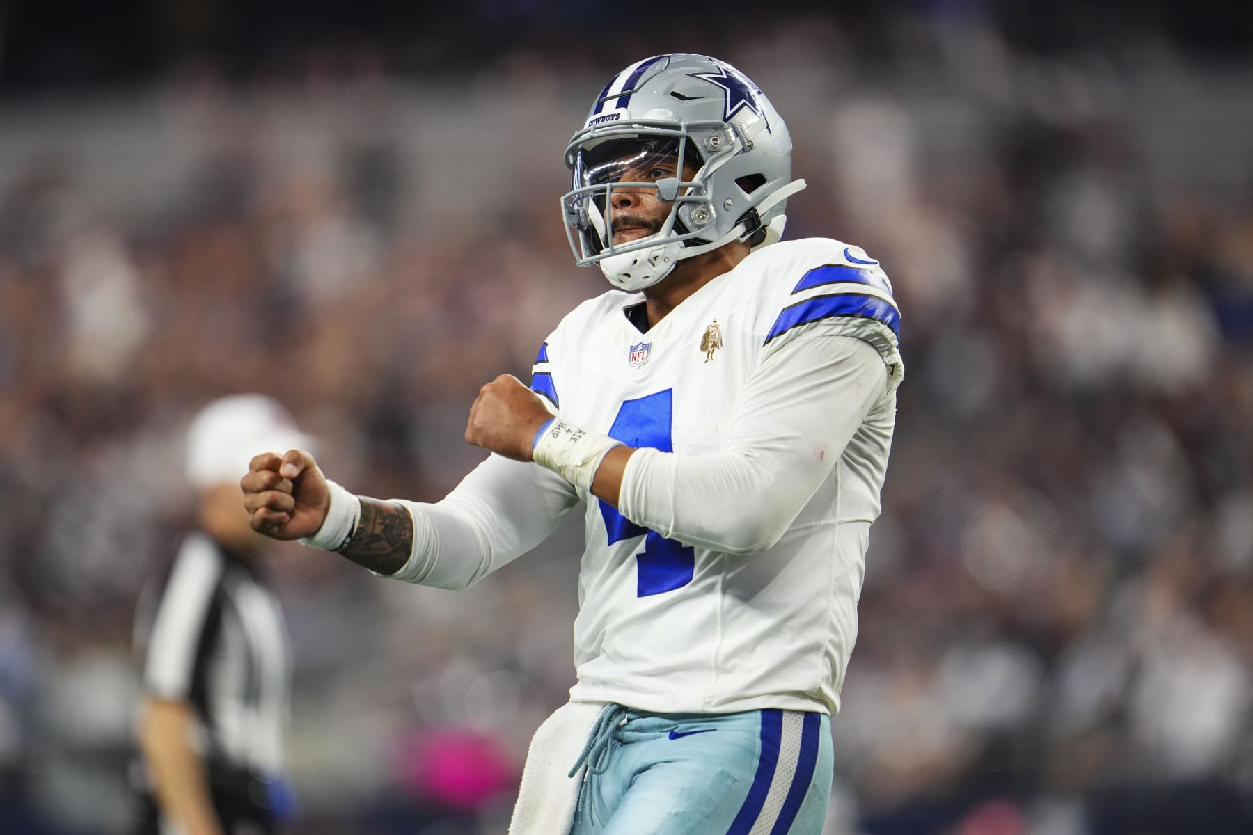 ARLINGTON, TX - OCTOBER 01: Dak Prescott #4 of the Dallas Cowboys celebrates at AT&T Stadium on October 1, 2023 in Arlington, Texas. (Photo by Cooper Neill/Getty Images)