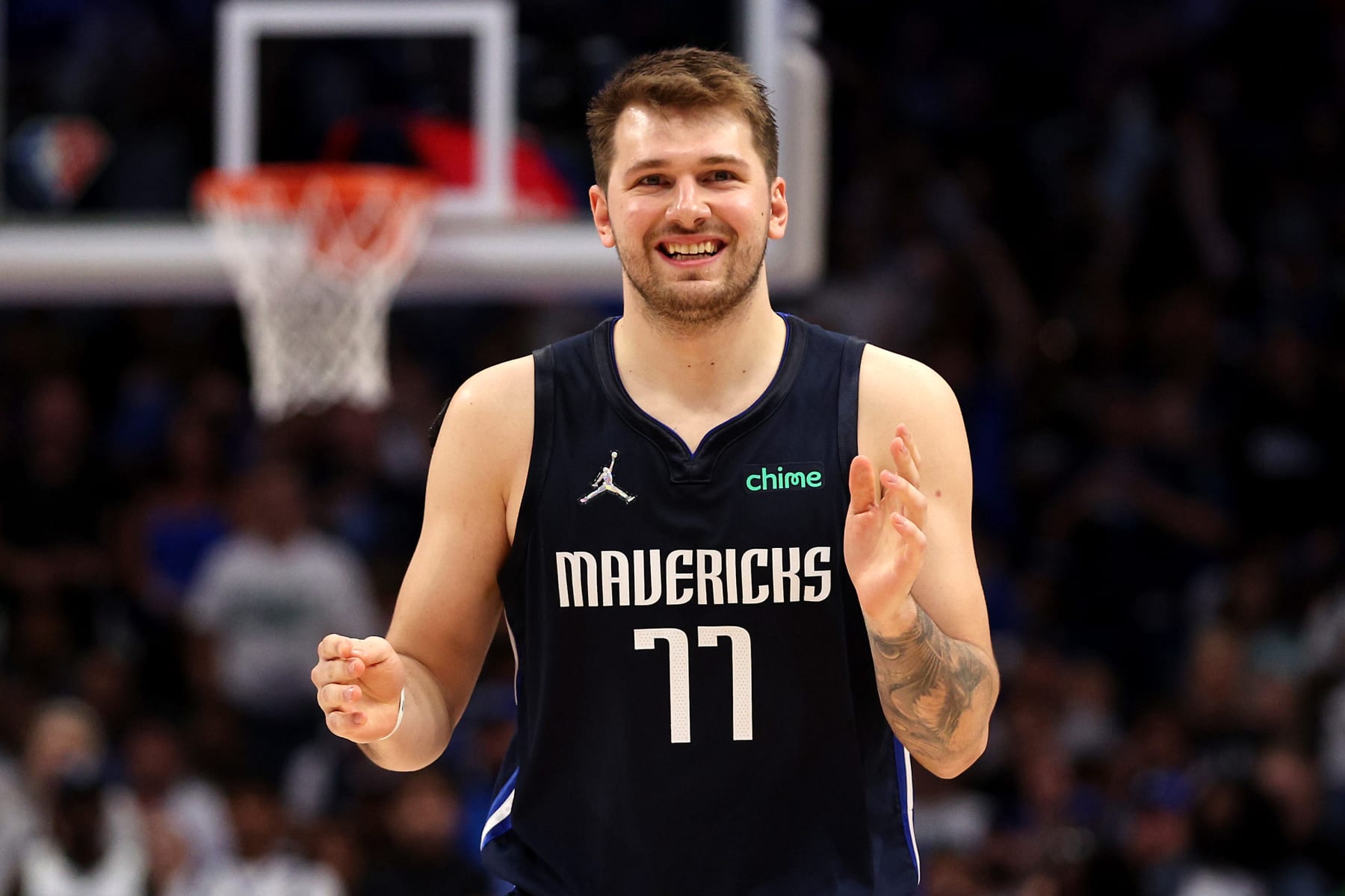 DALLAS, TEXAS - MAY 22: Luka Doncic #77 of the Dallas Mavericks reacts to a play during the second quarter against the Golden State Warriors in Game Three of the 2022 NBA Playoffs Western Conference Finals at American Airlines Center on May 22, 2022 in Dallas, Texas. NOTE TO USER: User expressly acknowledges and agrees that, by downloading and or using this photograph, User is consenting to the terms and conditions of the Getty Images License Agreement. (Photo by Tom Pennington/Getty Images)