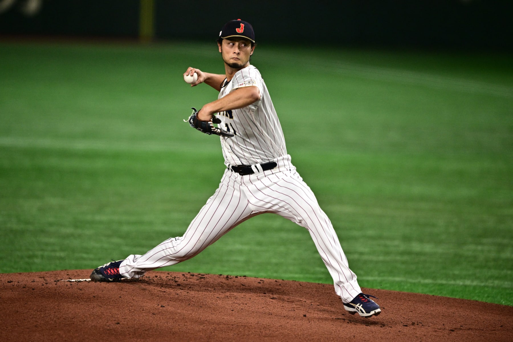 Japan's Yu Darvish pitches during the World Baseball Classic (WBC) Pool B round game between Japan and South Korea at the Tokyo Dome in Tokyo on March 10, 2023. (Photo by Philip FONG / AFP) (Photo by PHILIP FONG/AFP via Getty Images)