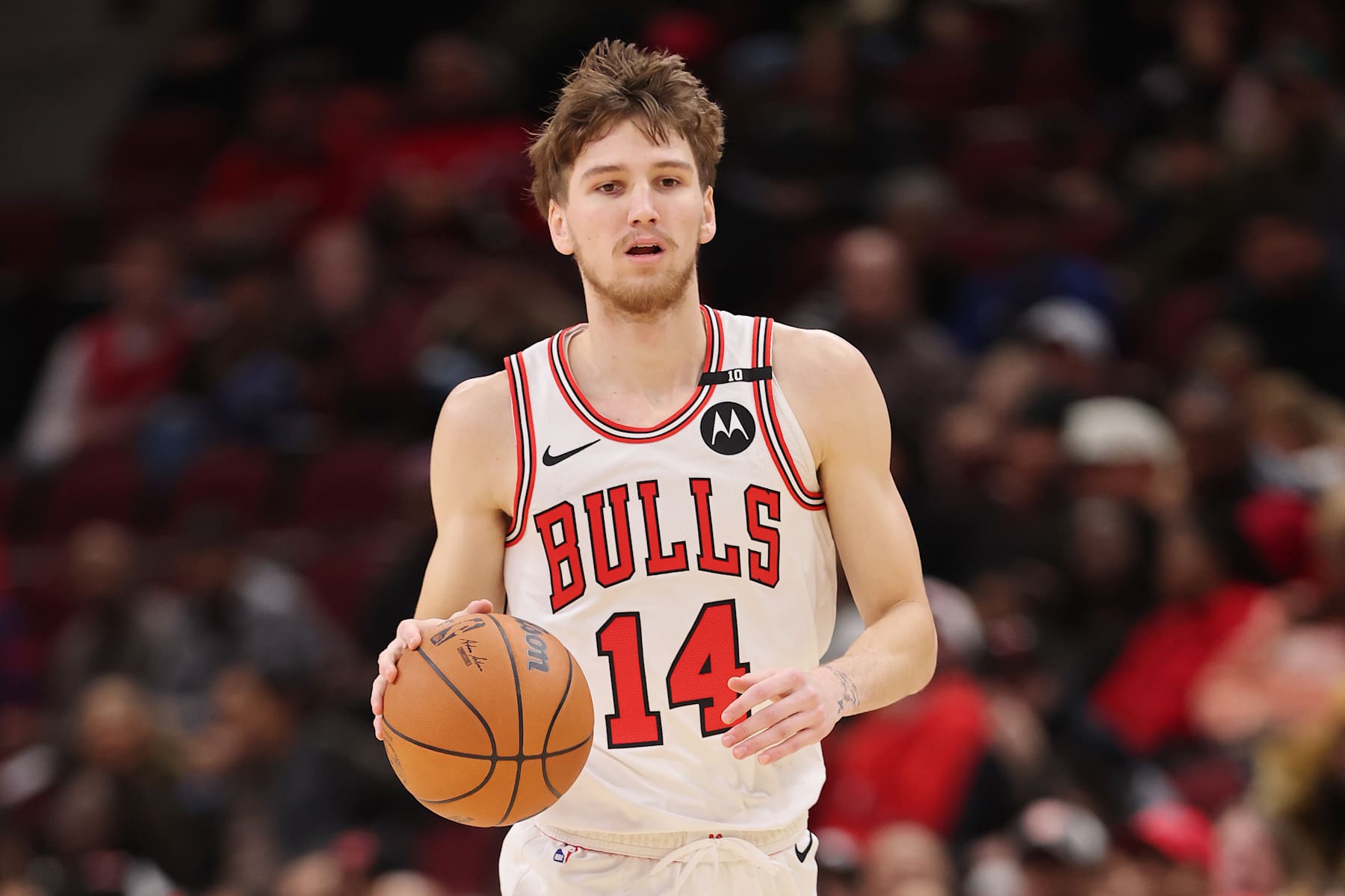 CHICAGO, ILLINOIS - DECEMBER 08: Matas Buzelis #14 of the Chicago Bulls dribbles up the court against the Philadelphia 76ers during the second half at the United Center on December 08, 2024 in Chicago, Illinois. NOTE TO USER: User expressly acknowledges and agrees that, by downloading and or using this photograph, User is consenting to the terms and conditions of the Getty Images License Agreement.  (Photo by Michael Reaves/Getty Images)