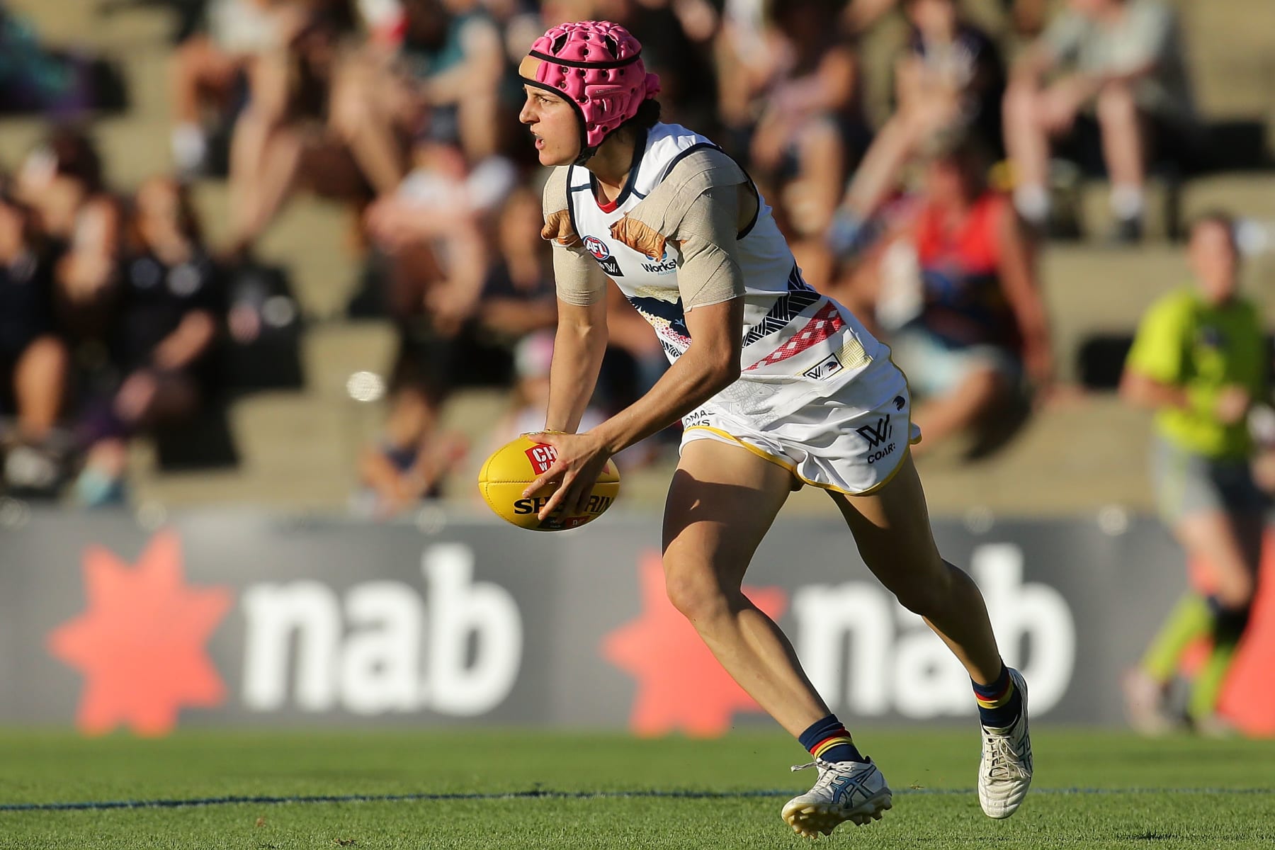 FREMANTLE, WESTERN AUSTRALIA - FEBRUARY 26: Heather Anderson of the Crows looks to pass the ball during the round four AFL Women's match between the Fremantle Dockers and the Adelaide Crows at Fremantle Oval on February 26, 2017 in Fremantle, Australia.  (Photo by Will Russell/AFL Media/Getty Images)
