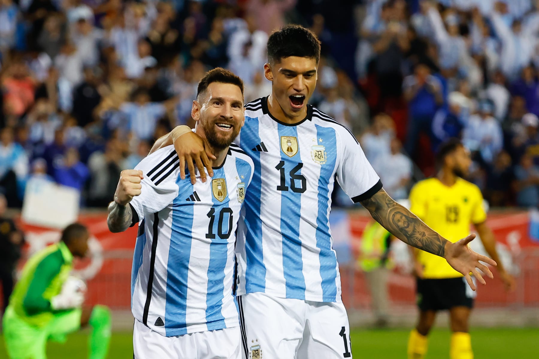 HARRISON, NJ - SEPTEMBER 27:  Argentina forward Lionel Messi (10) celebrates with teammate Argentina forward Joaquin Correa (16) after scoring during the international friendly soccer game between Argentina and Jamaica on September 27, 2022 at Red Bull Arena in Harrison, New Jersey.  (Photo by Rich Graessle/Icon Sportswire via Getty Images)