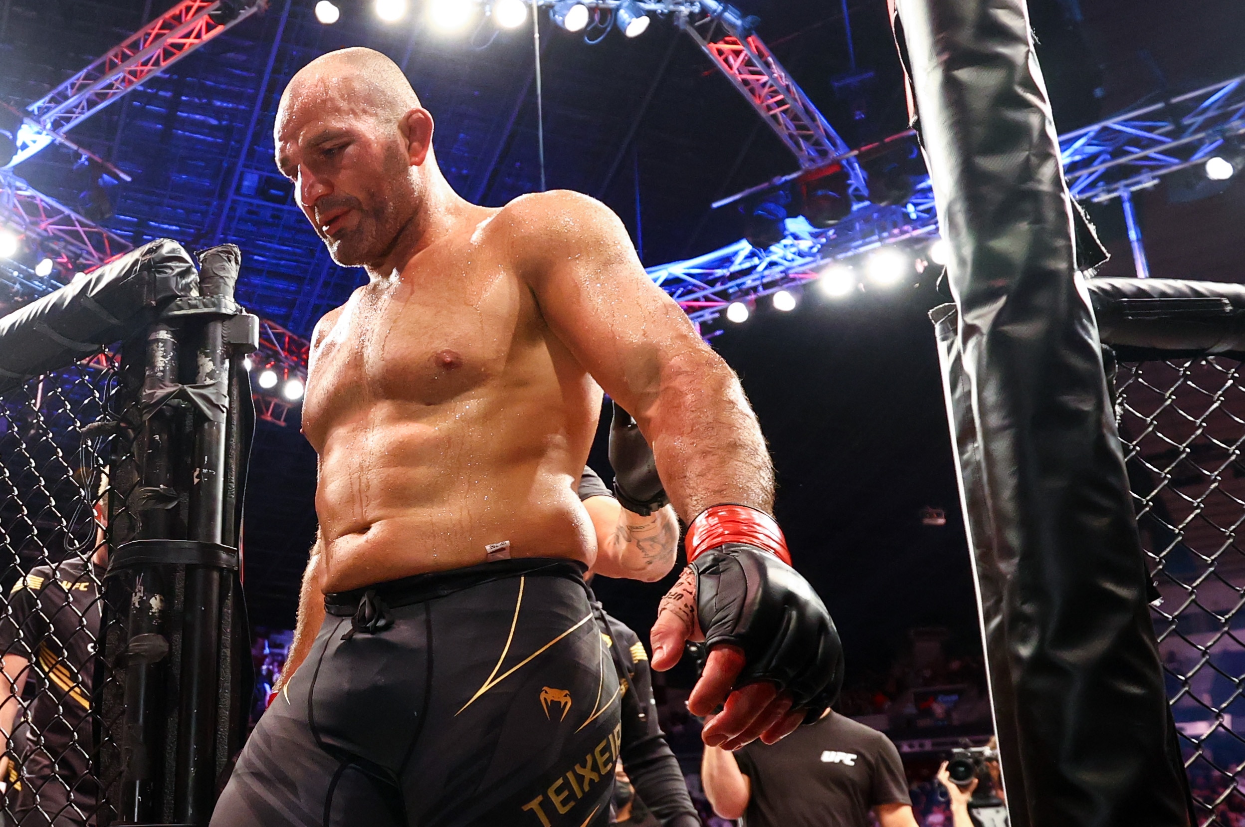 SINGAPORE, SINGAPORE - JUNE 12: Glover Teixeira of Brazil leaves the cage after fighting Jiri Prochazka of Czech Republic during their light Heavyweight Championship Fight at Singapore Indoor Stadium on June 12, 2022 in Singapore. (Photo by Yong Teck Lim/Getty Images)