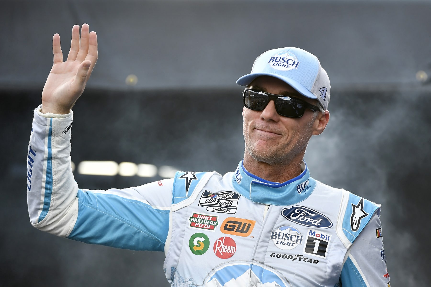 DARLINGTON, SOUTH CAROLINA - SEPTEMBER 04: Kevin Harvick, driver of the #4 Busch Light Retro Ford, waves to fans as he walks onstage during driver intros prior to the NASCAR Cup Series Cook Out Southern 500 at Darlington Raceway on September 04, 2022 in Darlington, South Carolina. (Photo by Logan Riely/Getty Images)