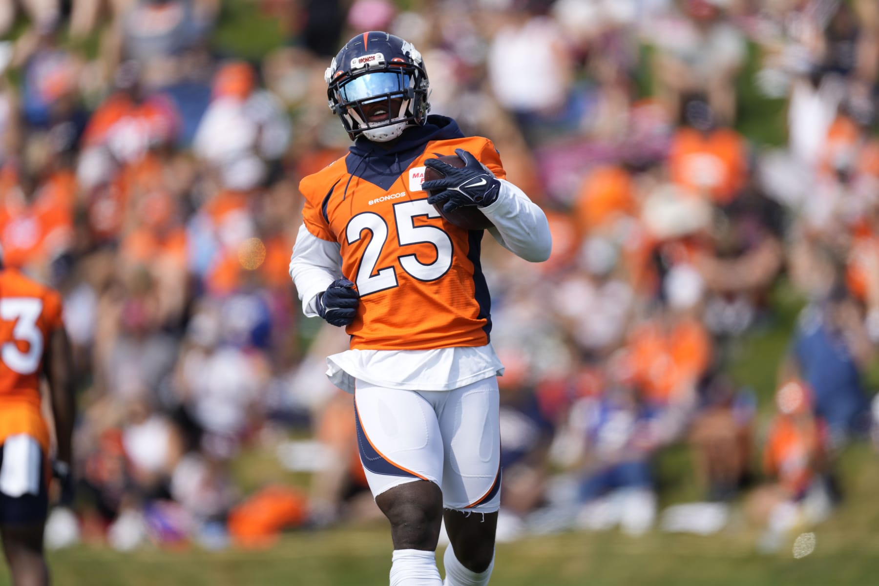 Denver Broncos running back Melvin Gordon III (25) takes part in drills during the NFL football team's training camp Friday, July 29, 2022,in Centennial, Colo. (AP Photo/David Zalubowski)