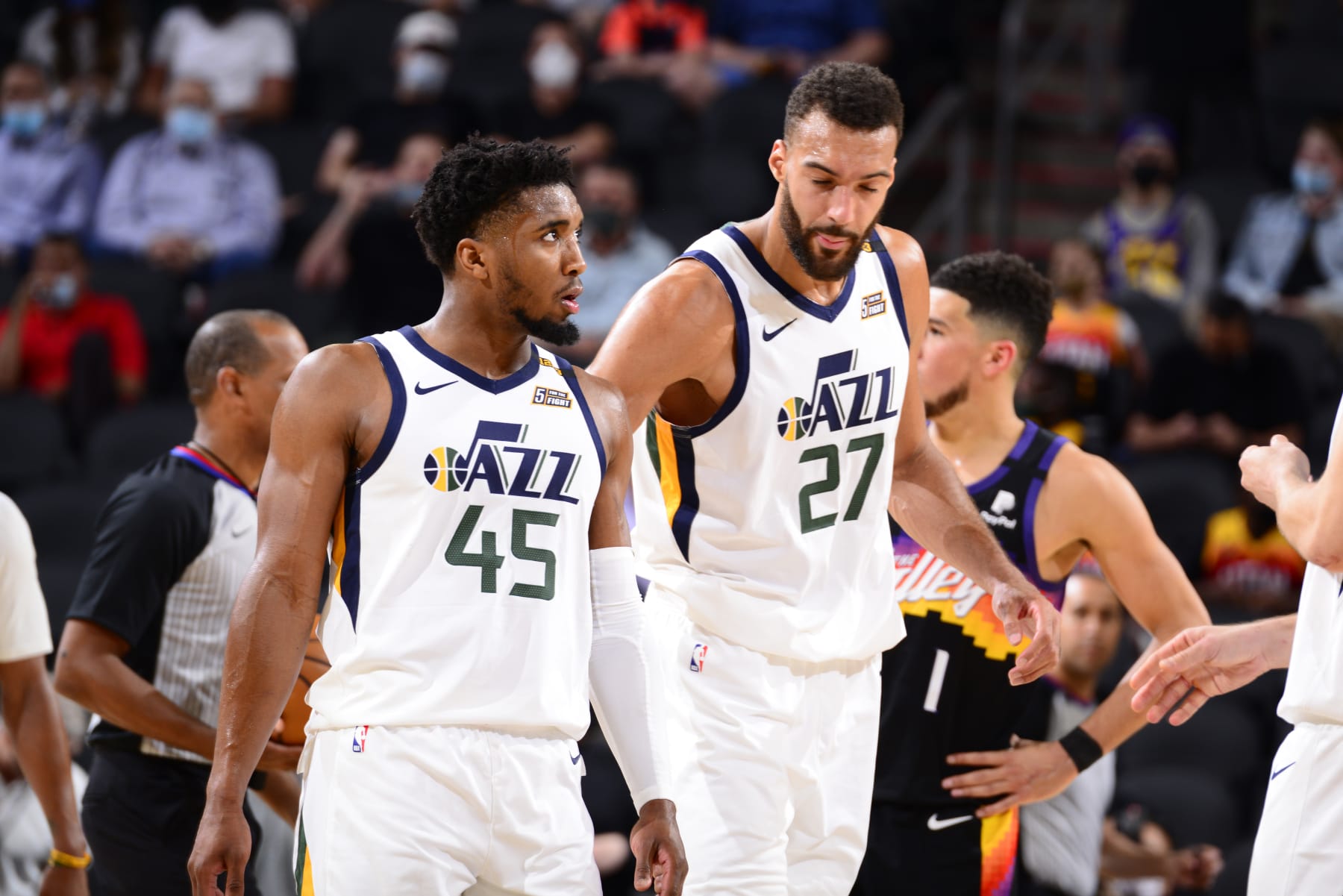 PHOENIX, AZ - APRIL 7: Donovan Mitchell #45 talks with Rudy Gobert #27 of the Utah Jazz during the game against the Phoenix Suns on April 7, 2021 at Phoenix Suns Arena in Phoenix, Arizona. NOTE TO USER: User expressly acknowledges and agrees that, by downloading and or using this photograph, user is consenting to the terms and conditions of the Getty Images License Agreement. Mandatory Copyright Notice: Copyright 2021 NBAE (Photo by Barry Gossage/NBAE via Getty Images)
