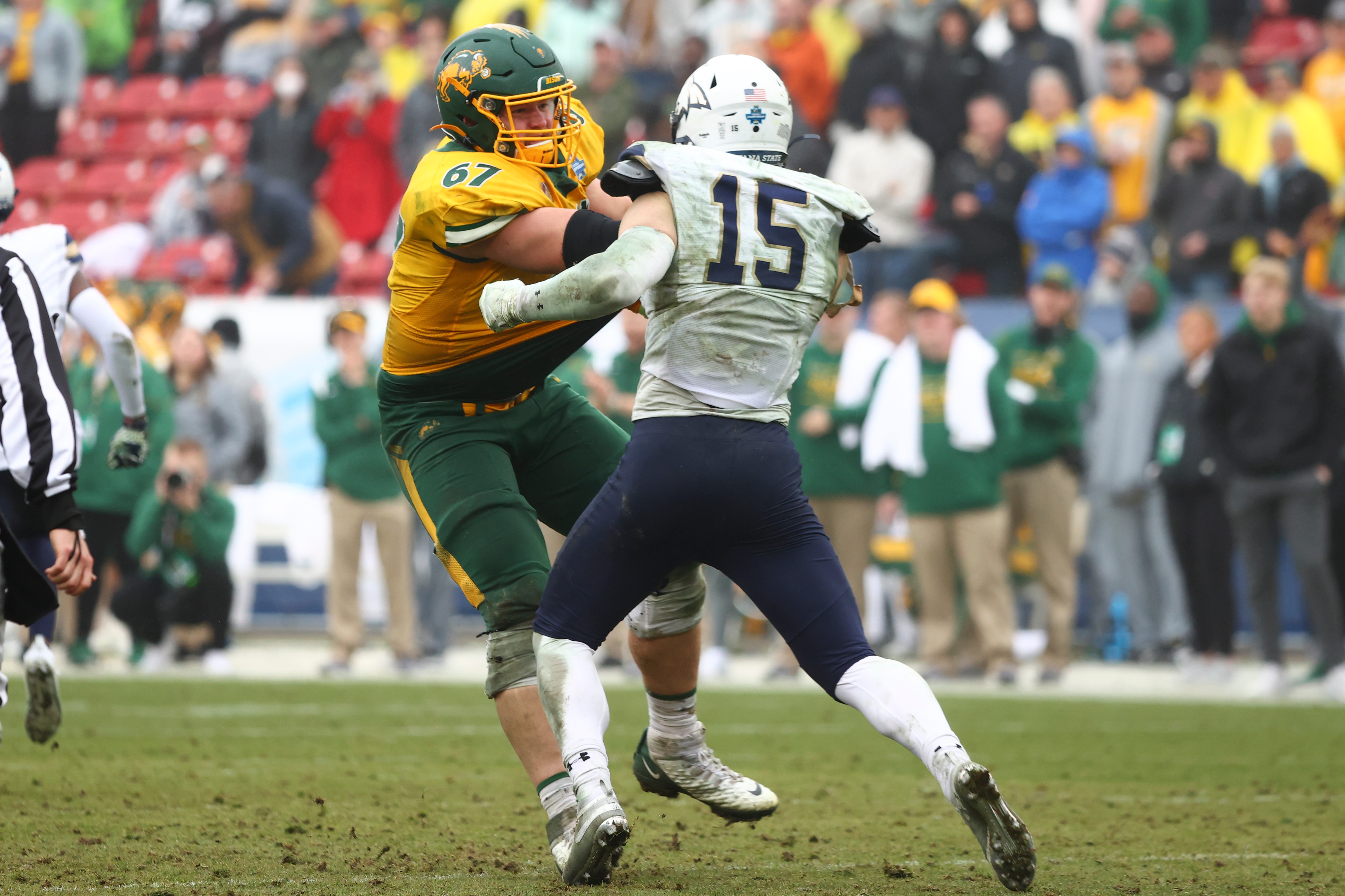FRISCO, TX - JANUARY 08: Cordell Volson #67 of the North Dakota State Bison blocks Troy Andersen #15 of the Montana State Bobcats during the Division I FCS Football Championship held at Toyota Stadium on January 8, 2022 in Frisco, Texas. (Photo by C. Morgan Engel/NCAA Photos via Getty Images)