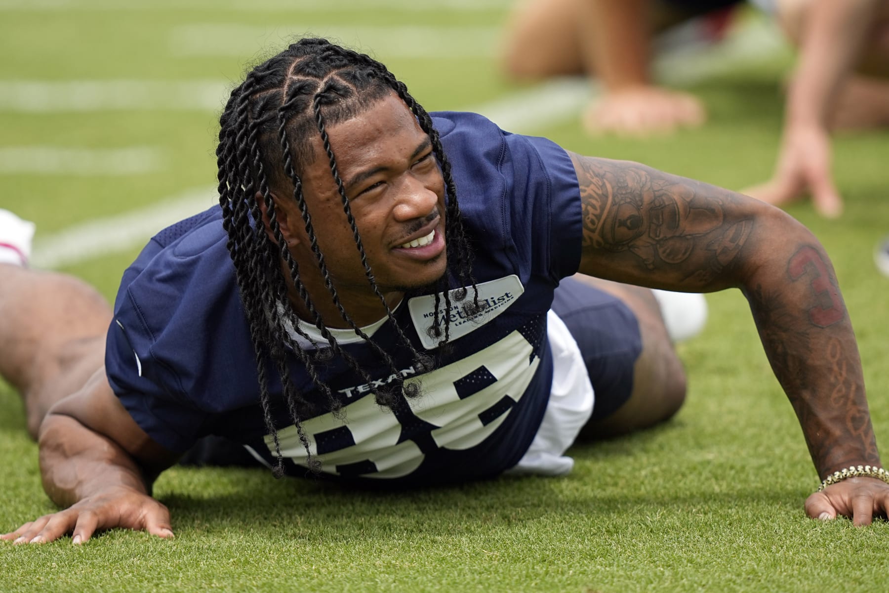 Houston Texans draft pick John Metchie III stretches during an NFL football rookie minicamp practice Friday, May 13, 2022, in Houston. (AP Photo/David J. Phillip) Houston Texans draft pick John Metchie III stretches during an NFL football rookie minicamp practice Friday, May 13, 2022, in Houston. (AP Photo/David J. Phillip)