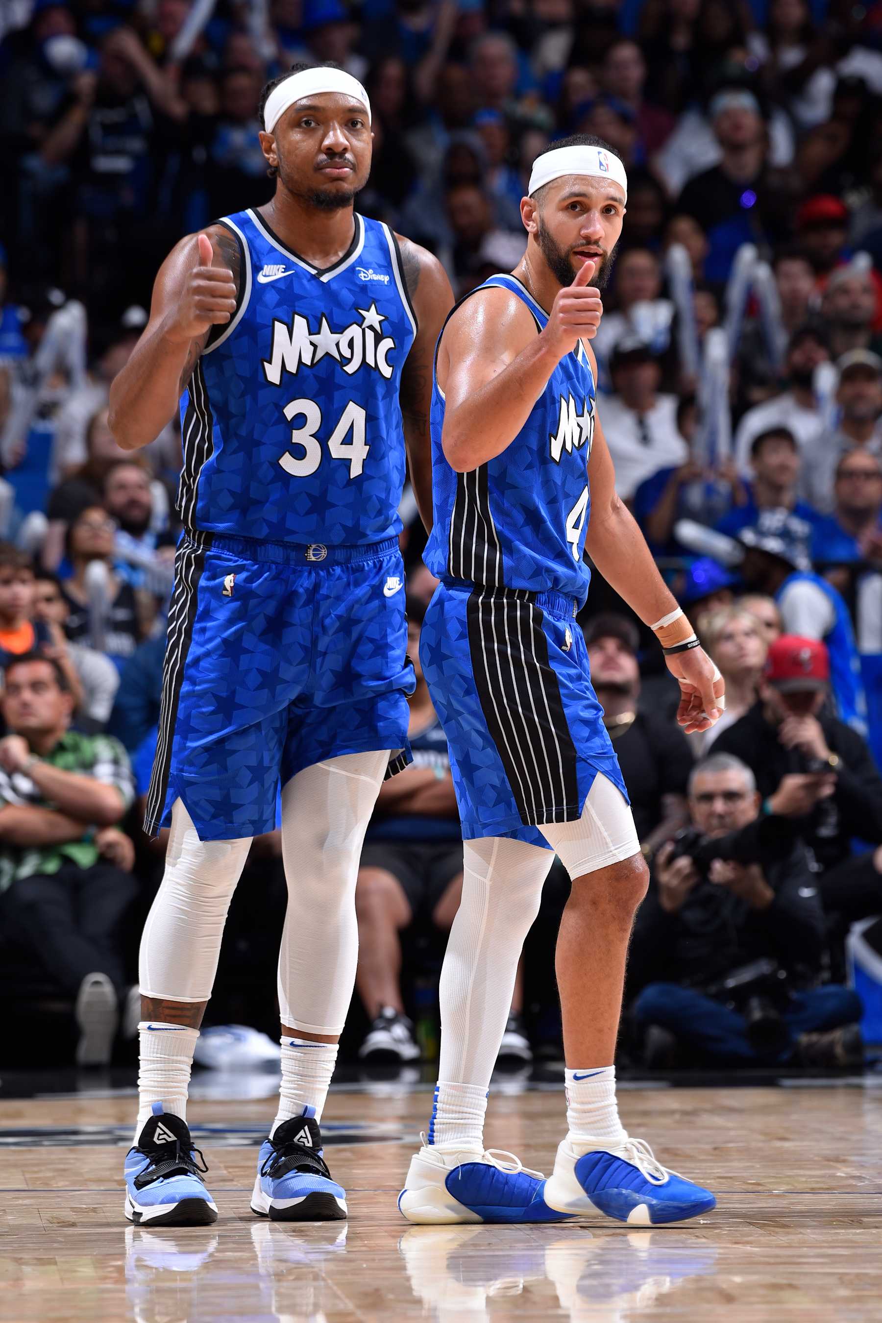 ORLANDO, FL - APRIL 14: Wendell Carter Jr. #34 and Jalen Suggs #4 of the Orlando Magic react during the game against the Milwaukee Bucks on April 14, 2024 at Kia Center in Orlando, Florida. NOTE TO USER: User expressly acknowledges and agrees that, by downloading and or using this photograph, User is consenting to the terms and conditions of the Getty Images License Agreement. Mandatory Copyright Notice: Copyright 2024 NBAE (Photo by Gary Bassing/NBAE via Getty Images)