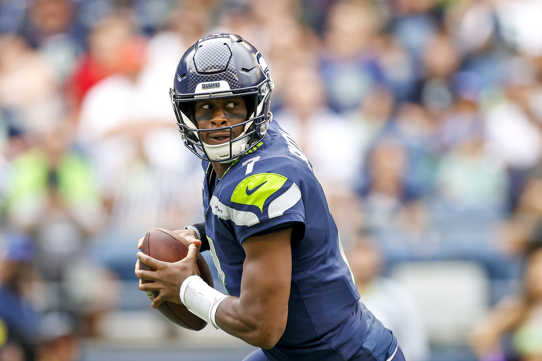 SEATTLE, WASHINGTON - AUGUST 18: Geno Smith #7 of the Seattle Seahawks looks to make a pass in the first quarter during the preseason game against the Chicago Bears at Lumen Field on August 18, 2022 in Seattle, Washington. (Photo by Steph Chambers/Getty Images)