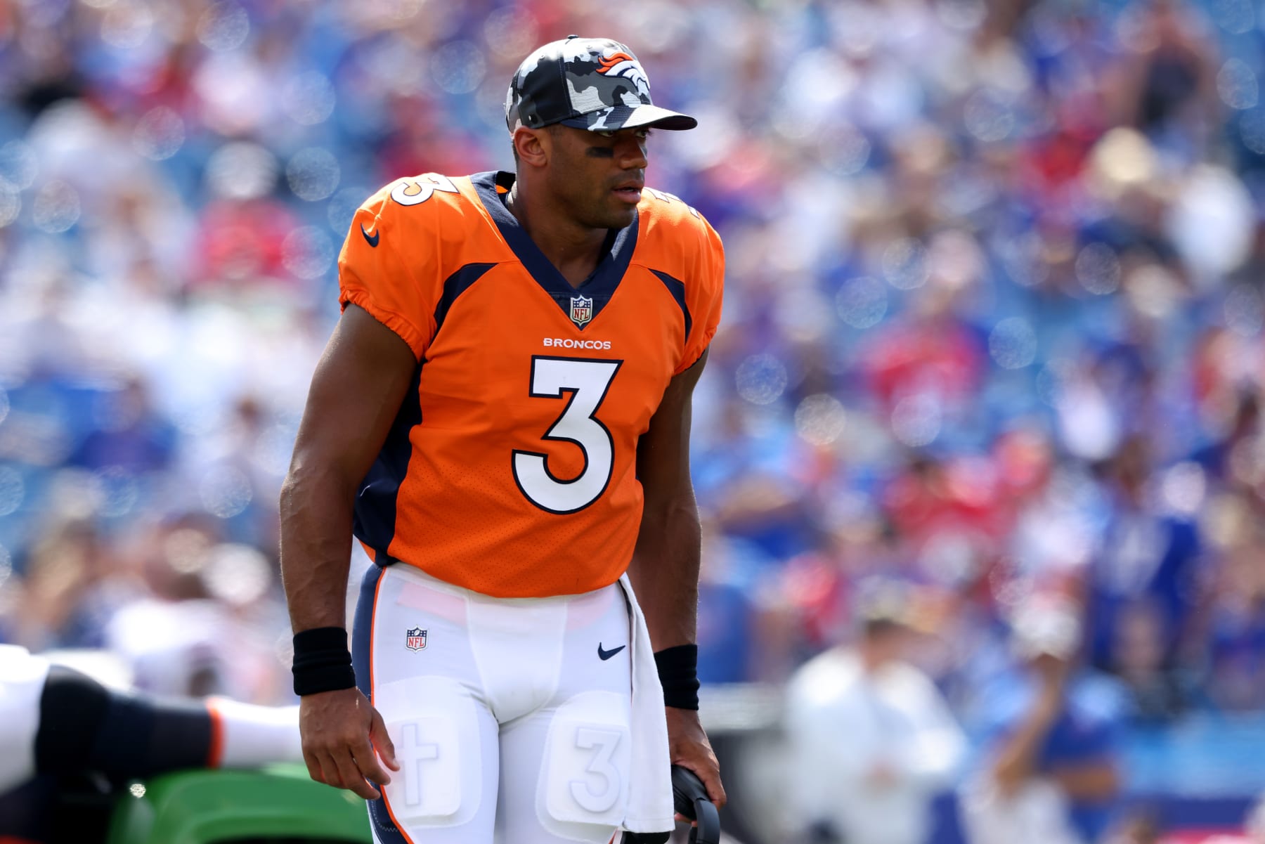 ORCHARD PARK, NEW YORK - AUGUST 20: Russell Wilson #3 of the Denver Broncos runs off the field during the third quarter of a preseason game against the Buffalo Bills at Highmark Stadium on August 20, 2022 in Orchard Park, New York. (Photo by Bryan Bennett/Getty Images)