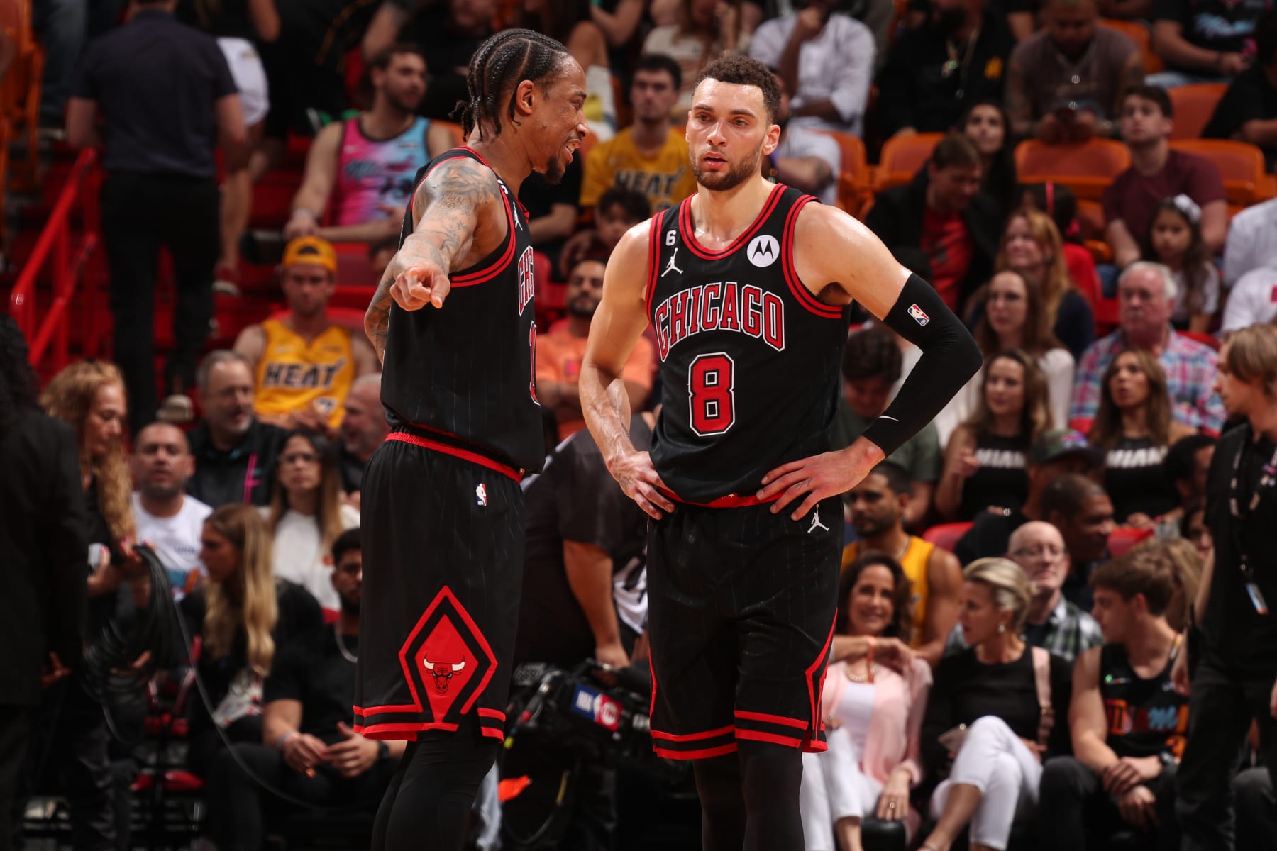MIAMI, FL - APRIL 14: DeMar DeRozan #11 and Zach LaVine #8 of the Chicago Bulls talk during the game against the Miami Heat during the 2023 Play-In Tournament on April 14, 2023 at the Kaseya Center in Miami, Florida. NOTE TO USER: User expressly acknowledges and agrees that, by downloading and or using this Photograph, user is consenting to the terms and conditions of the Getty Images License Agreement. Mandatory Copyright Notice: Copyright 2023 NBAE (Photo by Issac Baldizon/NBAE via Getty Images)