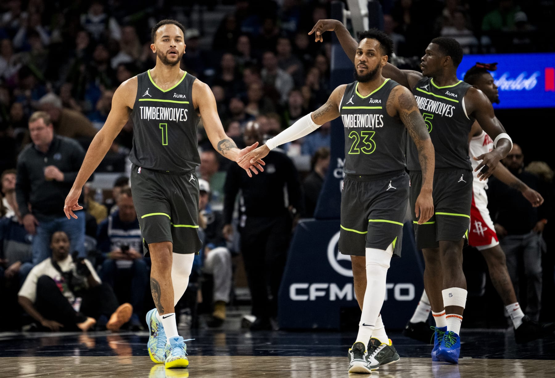 MINNEAPOLIS, MINNESOTA - APRIL 2: Kyle Anderson #1 of the Minnesota Timberwolves high fives Monte Morris #23 in the third quarter of the game against the Houston Rockets at Target Center on April 2, 2024 in Minneapolis, Minnesota. NOTE TO USER: User expressly acknowledges and agrees that, by downloading and or using this photograph, User is consenting to the terms and conditions of the Getty Images License Agreement. (Photo by Stephen Maturen/Getty Images)