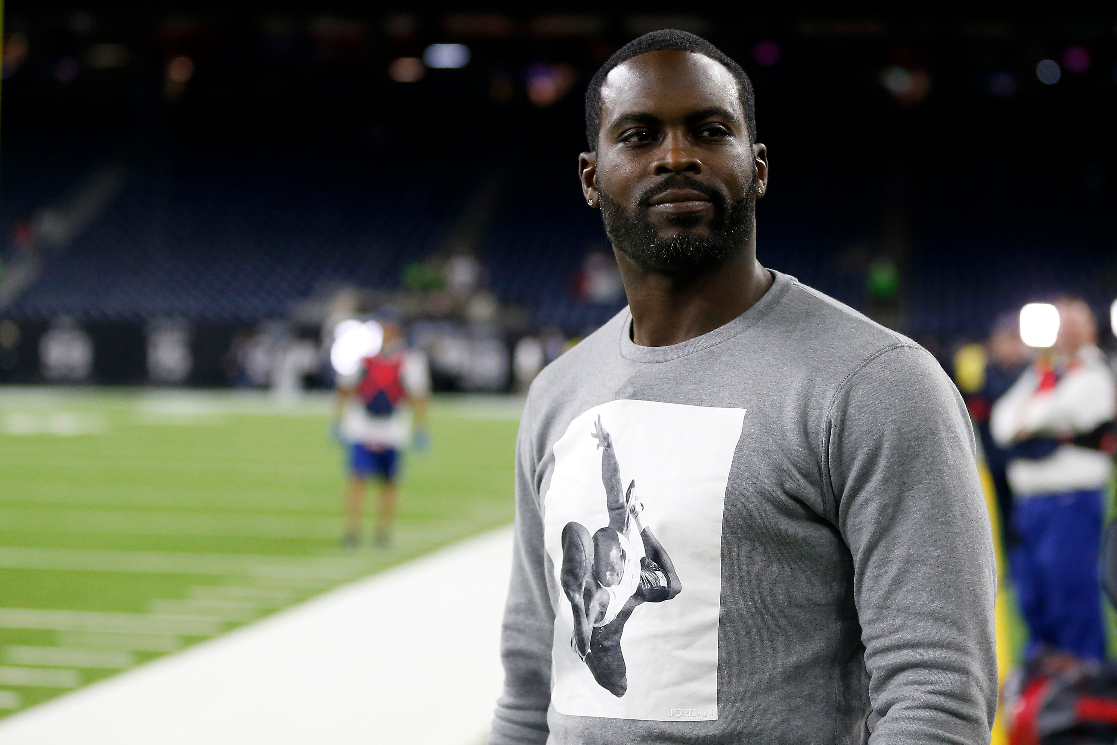 HOUSTON, TEXAS - DECEMBER 01: Former quarterback Michael Vick looks on prior to the game between the New England Patriots and the Houston Texans at NRG Stadium on December 01, 2019 in Houston, Texas. (Photo by Bob Levey/Getty Images)