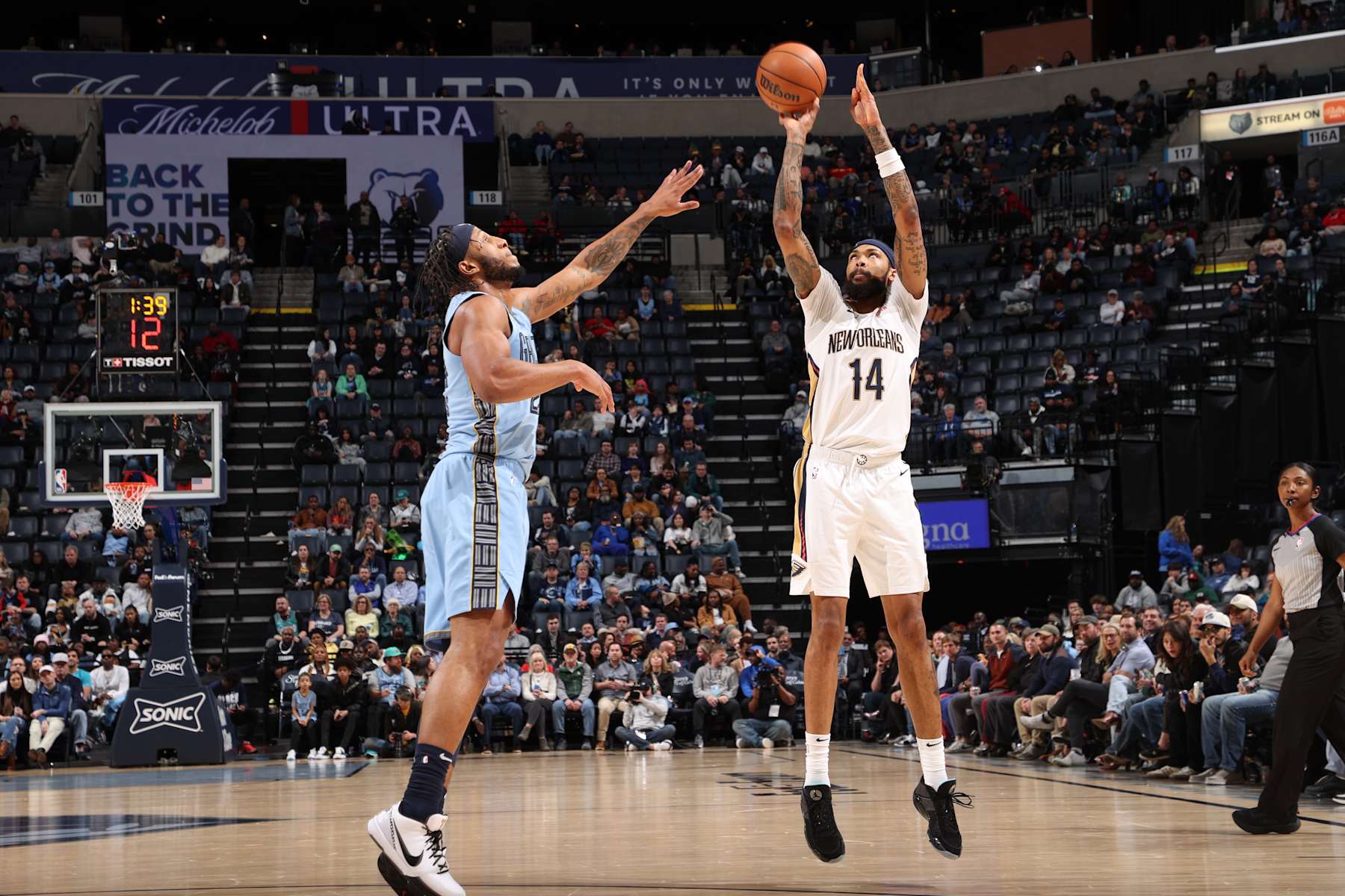 MEMPHIS, TN - FEBRUARY 12: Brandon Ingram #14 of the New Orleans Pelicans shoots a three point basket against the Memphis Grizzlies on February 12, 2024 at FedExForum in Memphis, Tennessee. NOTE TO USER: User expressly acknowledges and agrees that, by downloading and or using this photograph, User is consenting to the terms and conditions of the Getty Images License Agreement. Mandatory Copyright Notice: Copyright 2024 NBAE (Photo by Joe Murphy/NBAE via Getty Images)