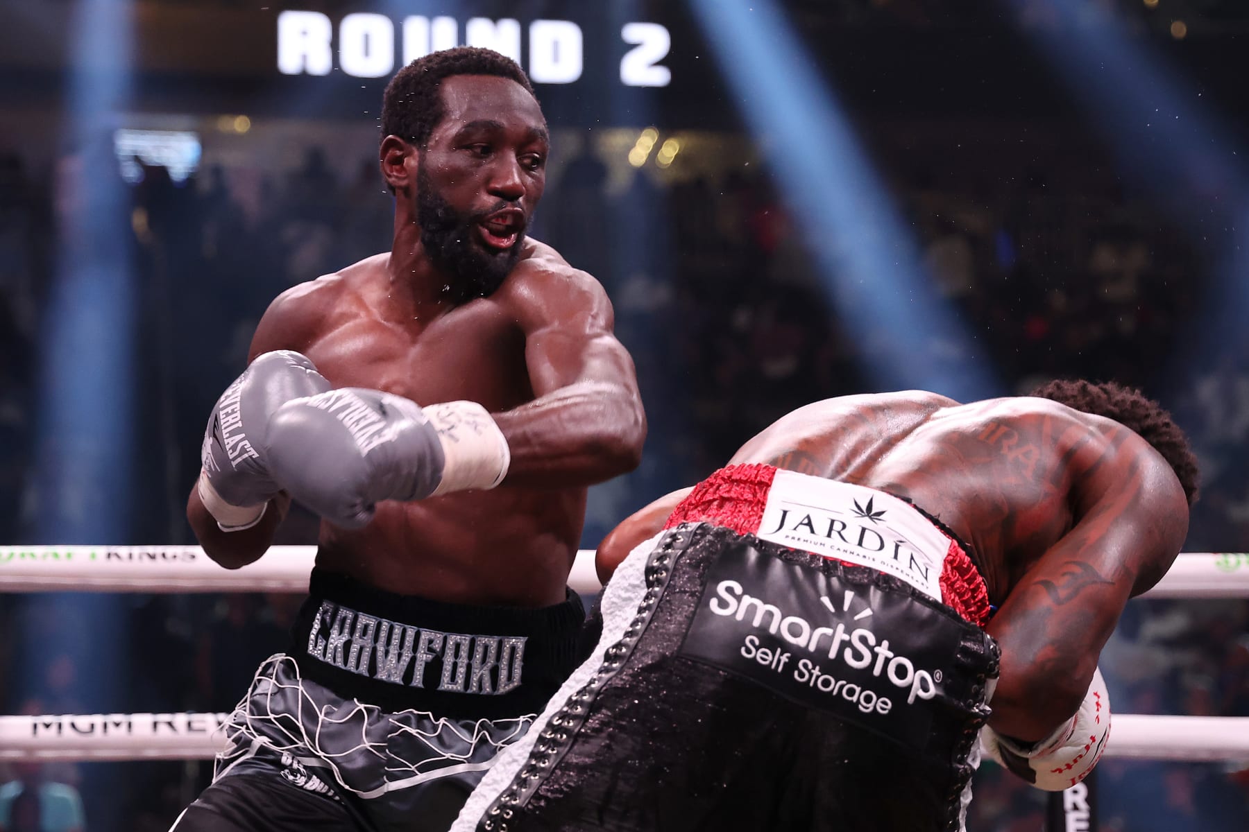 LAS VEGAS, NEVADA - JULY 29: Terence Crawford punches Errol Spence Jr. during round 2 of the World Welterweight Championship bout at T-Mobile Arena on July 29, 2023 in Las Vegas, Nevada. (Photo by Al Bello/Getty Images)