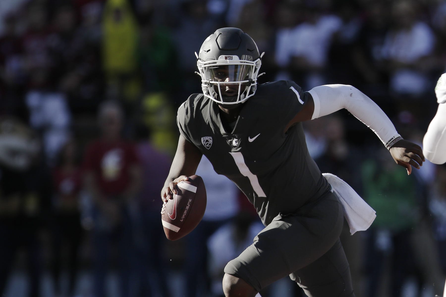 Washington State quarterback Cameron Ward looks for a receiver during the second half of an NCAA college football game against Oregon, Saturday, Sept. 24, 2022, in Pullman, Wash. (AP Photo/Young Kwak)