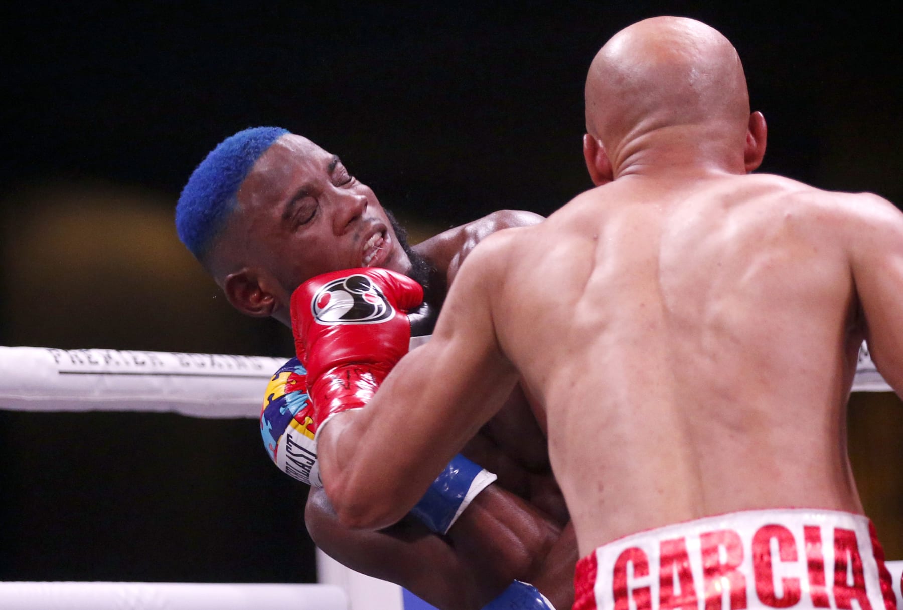 LAS VEGAS, NEVADA - FEBRUARY 26:  Chris Colbert (L) takes a punch from Hector Luis Garcia during a super featherweight bout at The Chelsea at The Cosmopolitan of Las Vegas on February 26, 2022 in Las Vegas, Nevada. Garcia won the fight by unanimous decision. (Photo by Steve Marcus/Getty Images)