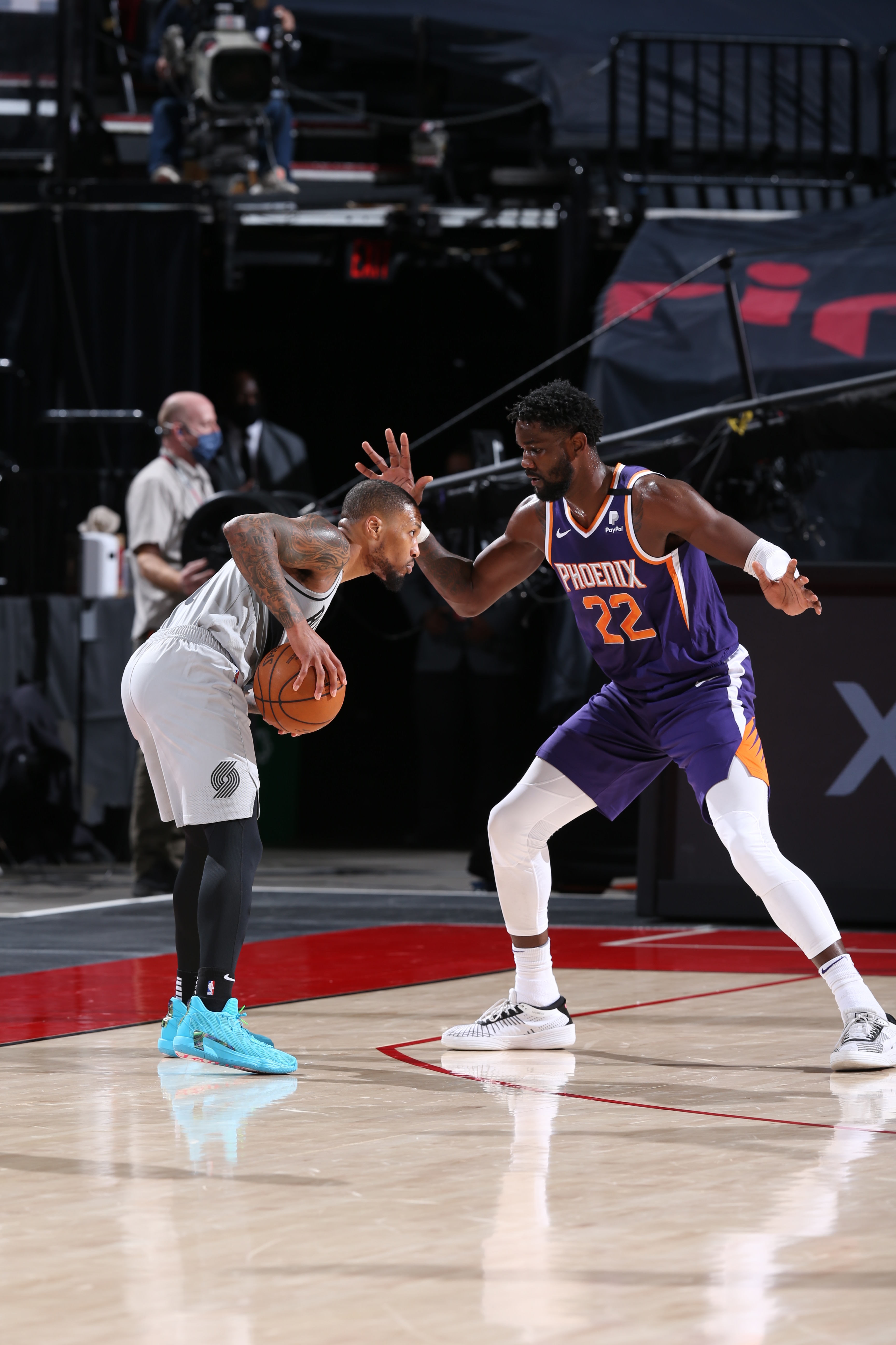 PORTLAND, OR - MARCH 11: Damian Lillard #0 of the Portland Trail Blazers handles the ball during the game against Deandre Ayton #22 of the Phoenix Suns on March 11, 2021 at the Moda Center Arena in Portland, Oregon. NOTE TO USER: User expressly acknowledges and agrees that, by downloading and or using this photograph, user is consenting to the terms and conditions of the Getty Images License Agreement. Mandatory Copyright Notice: Copyright 2021 NBAE (Photo by Sam Forencich/NBAE via Getty Images)