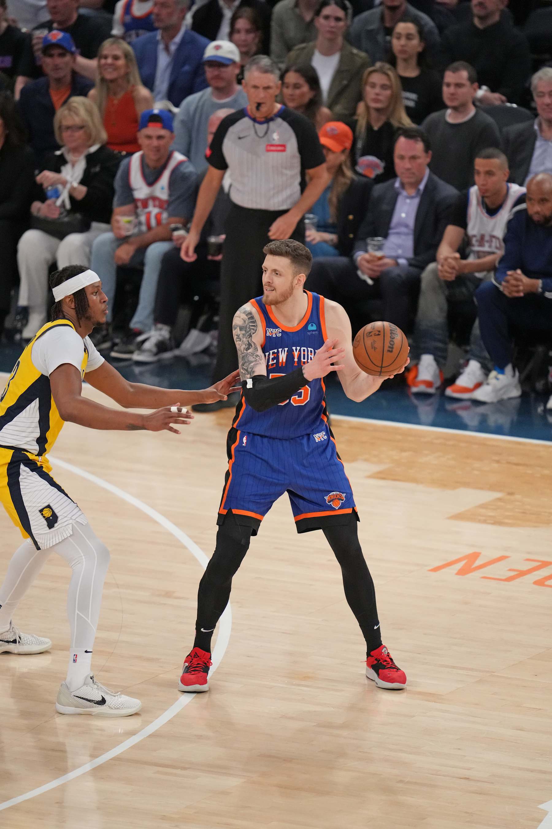 NEW YORK, NY - MAY 14: Isaiah Hartenstein #55 of the New York Knicks looks to pass the ball during the game against the Indiana Pacers during Round 2 Game 5 of the 2024 NBA Playoffs on May 14, 2024 at Madison Square Garden in New York City, New York.  NOTE TO USER: User expressly acknowledges and agrees that, by downloading and or using this photograph, User is consenting to the terms and conditions of the Getty Images License Agreement. Mandatory Copyright Notice: Copyright 2024 NBAE  (Photo by Jesse D. Garrabrant/NBAE via Getty Images)